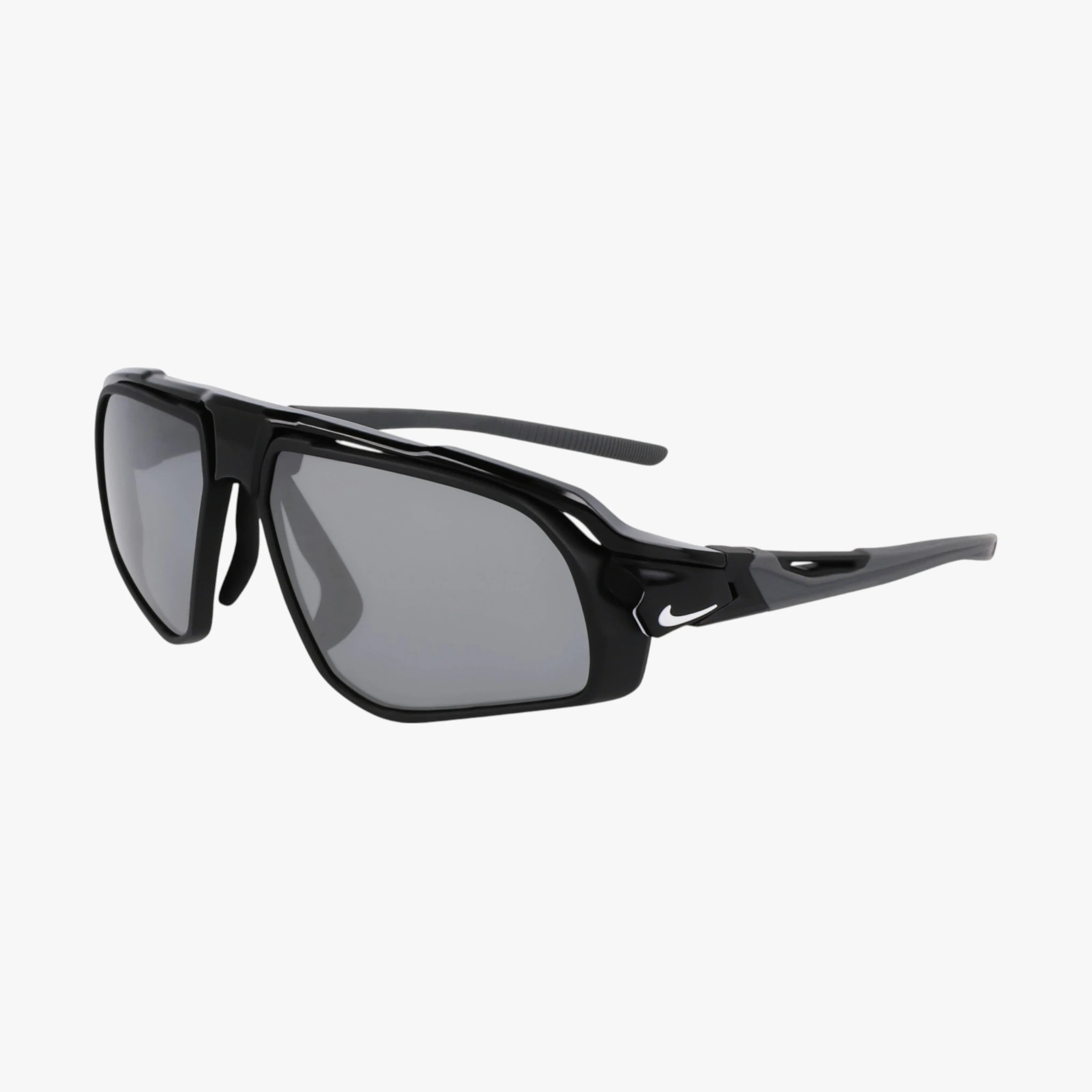 NIKE FLYFREE FV2387 sunglasses feature a black, sporty thick frame with rectangular gray UV-protective lenses and the NIKE logo on the temple. Modern cut-out details create an athletic look. Displayed on a white background.