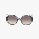 The Kate Spade FLYNNIE/G/S sunglasses feature oversized octagonal blue and beige tortoiseshell frames with gradient brown lenses, combining chic sun protection with style, shown on a white background.