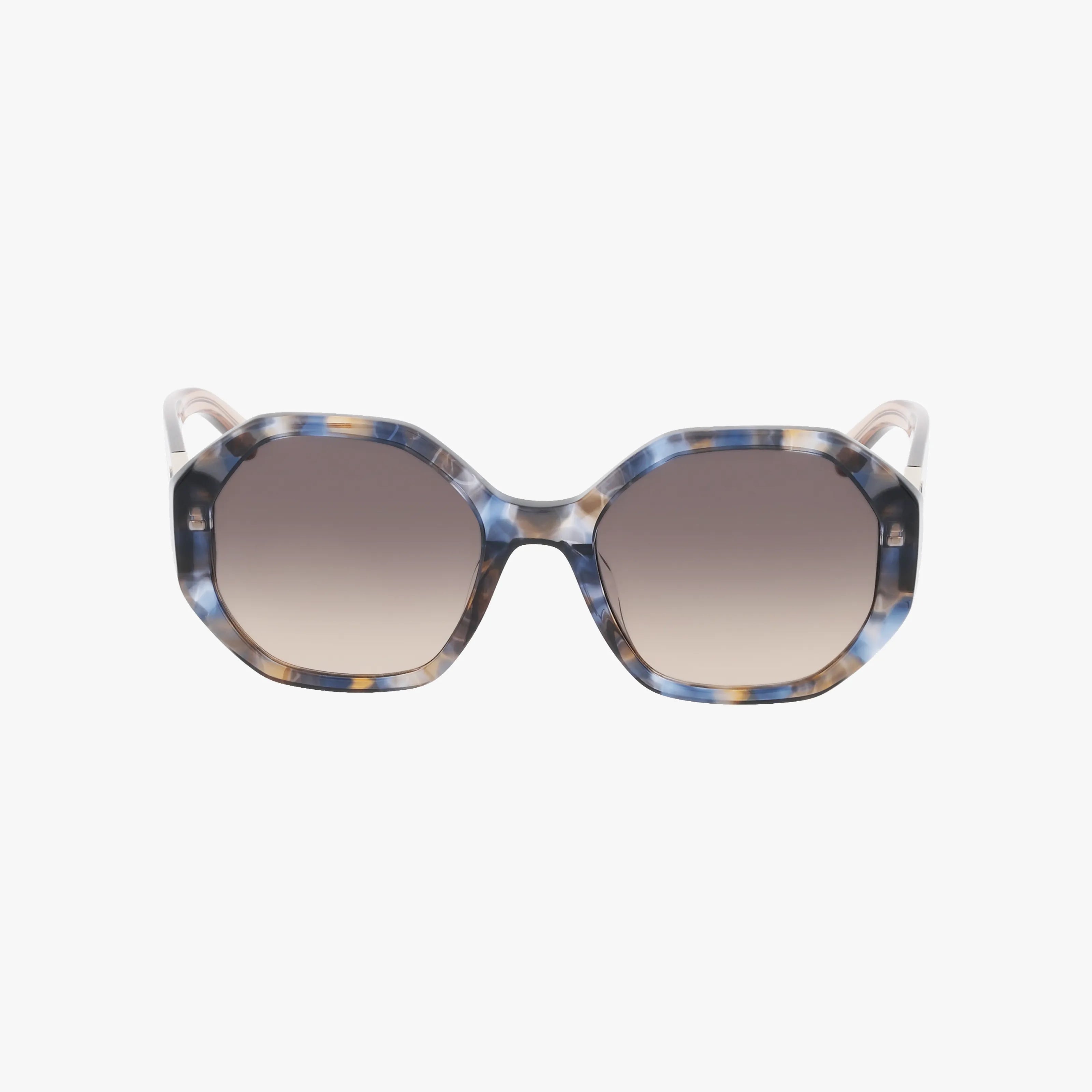 The Kate Spade FLYNNIE/G/S sunglasses feature oversized octagonal blue and beige tortoiseshell frames with gradient brown lenses, combining chic sun protection with style, shown on a white background.