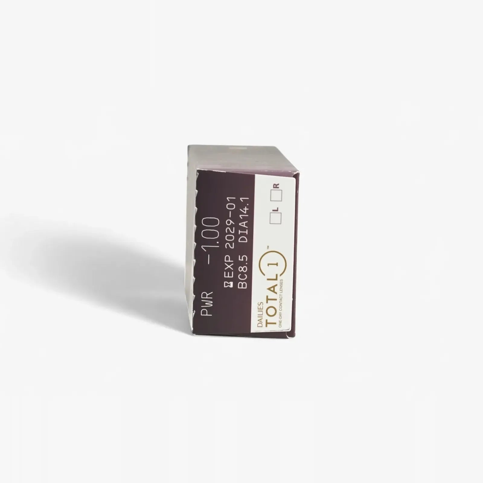 A brown and white box of Total1 Dailies Total 1 - 30 Pk silicone hydrogel contact lenses stands on its end, showing product details, prescription info, and expiry date on one side.