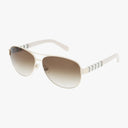 The Kate Spade DALIA/S US aviator sunglasses feature gold frames, brown gradient lenses, and white arms with gray chevron stripes near the hinges—ideal for your next outdoor adventure. Shown on a white background.
