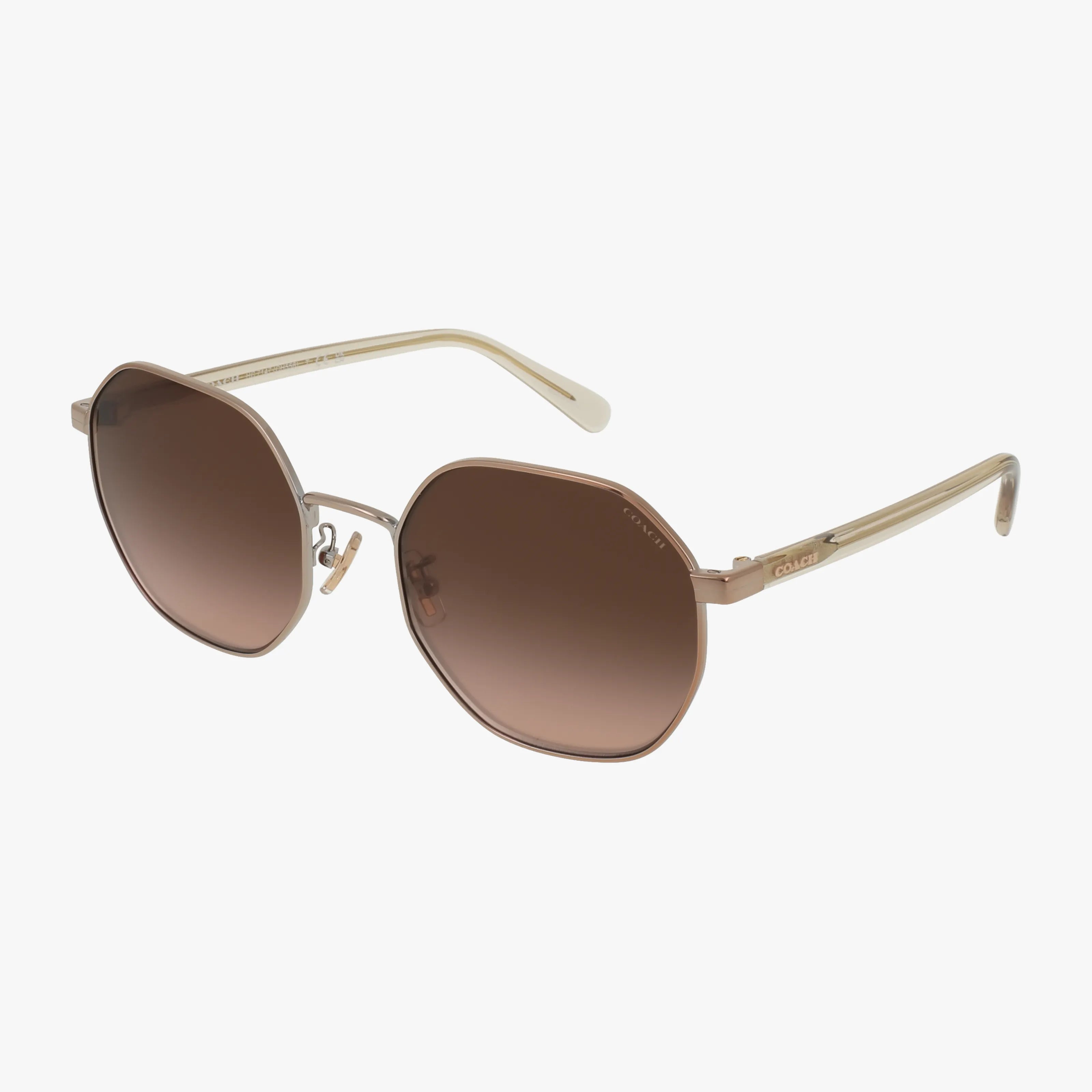 Coach HC7147 sunglasses feature octagonal frames with brown gradient lenses, slim gold metal construction, and matching gold arms, shown elegantly on a white background.
