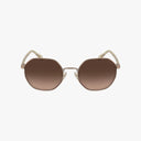 Front view of Coach HC7147 oversized geometric sunglasses with gold metal frames and brown gradient lenses shown against a white background.