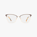 The St. Moritz BRIDGETTE eyeglasses feature gold metal frames, brown upper rim accents, and tortoiseshell-patterned temple tips, offering a stylish and functional design displayed on a plain white background.