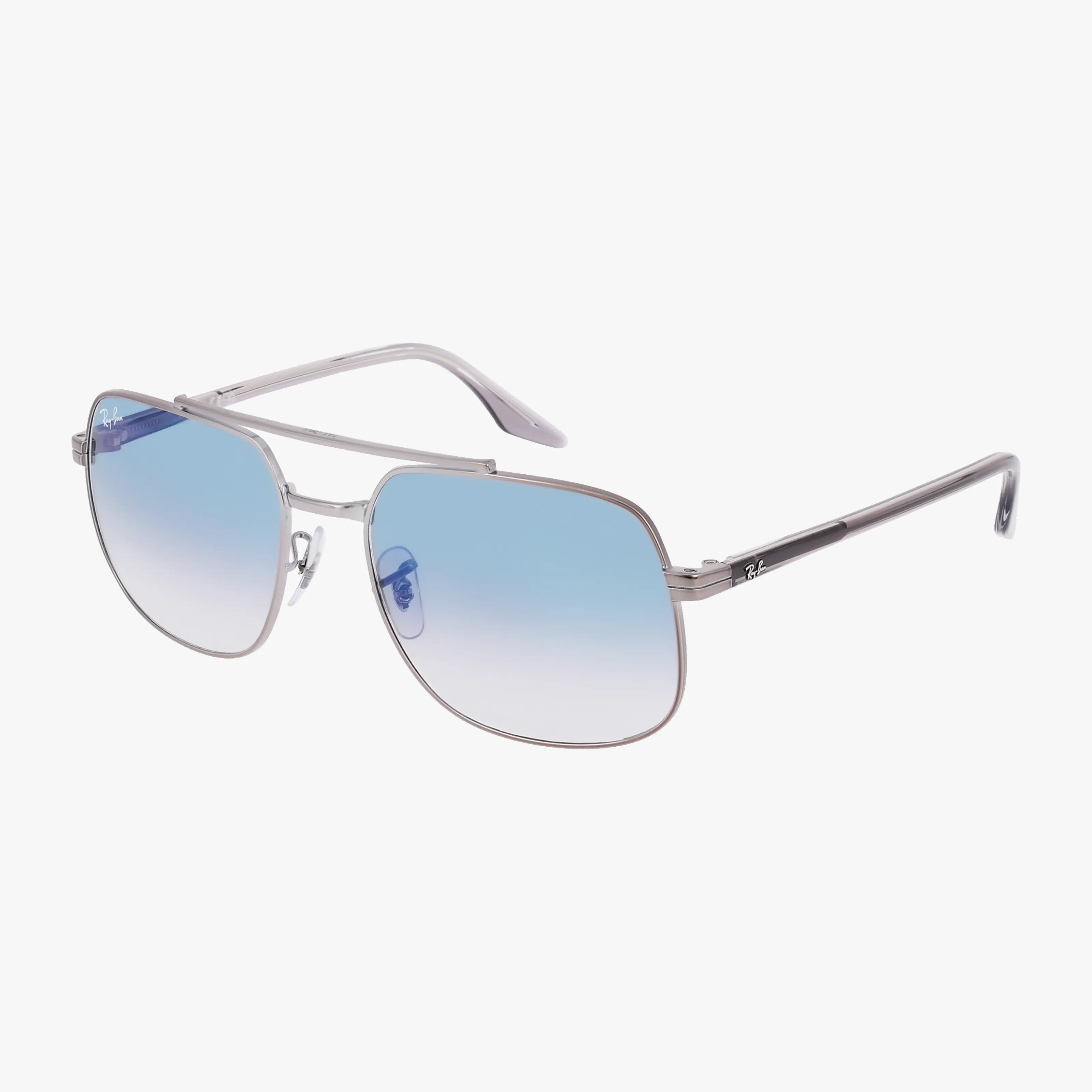 Ray-Ban RB3699 silver-framed aviator sunglasses feature gradient blue lenses and black arms, delivering stylish UV protection and clear vision benefits, shown against a white background.