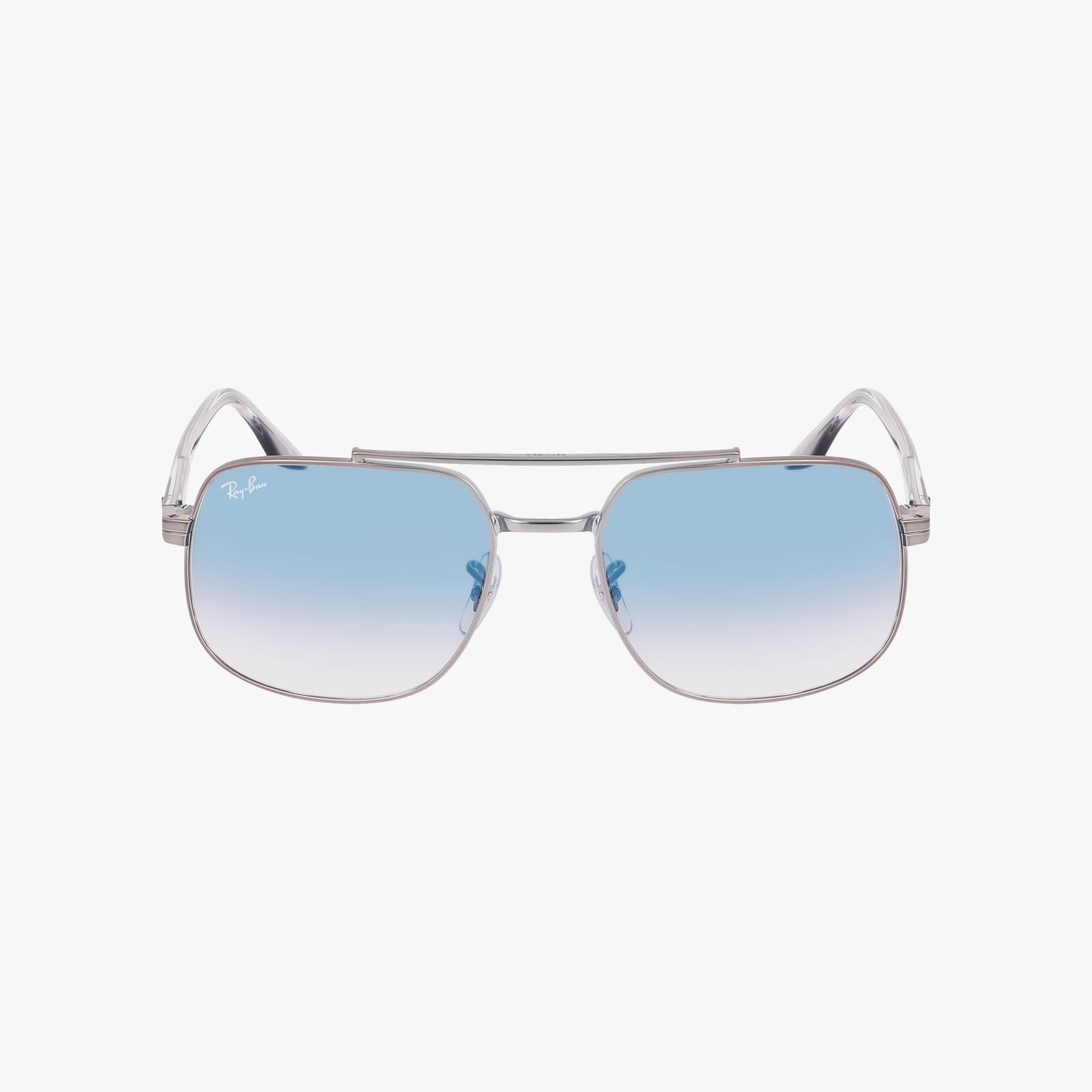 The Ray-Ban RB3699 features square aviator-style sunglasses with thin silver frames and light blue gradient lenses that provide UV protection, shown against a white background.