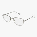 The Precision 161 eyeglasses feature a thin, rectangular metal frame in Gunmetal Matte with clear lenses and adjustable nose pads, combining distinct style and functionality, displayed on a plain white background.