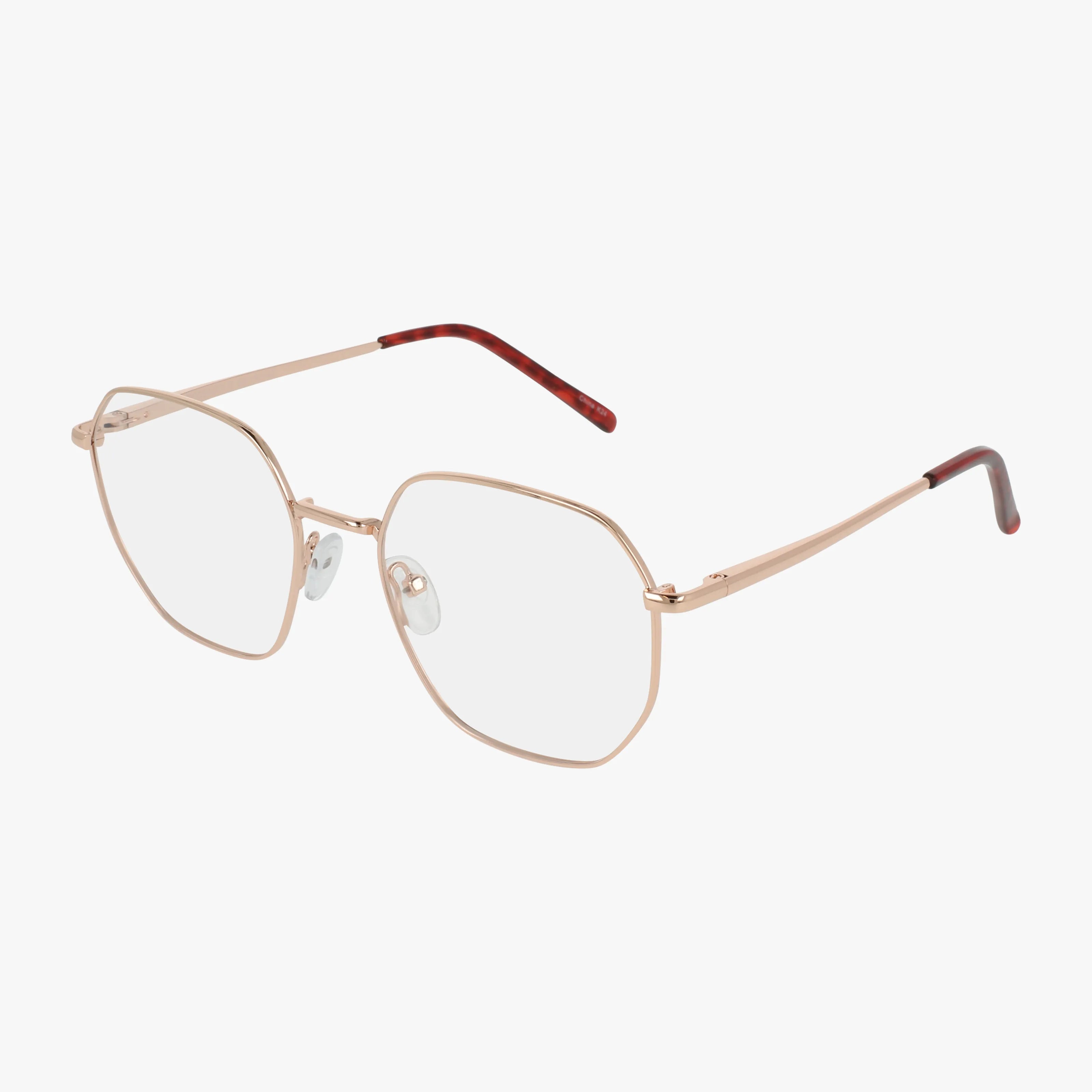 The Exclusive 265 eyeglasses feature gold rose, hexagonal frames with brown-tipped arms and clear nose pads for comfort. Prescription lenses can be added. Displayed on a white background, these bold specs stand out.