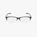 A pair of rectangular Nike Kids NIKE 5019 eyeglasses, featuring a chic black-to-clear fade frame, displayed against a plain white background.