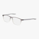 The NIKE 7125 by Nike features a rectangular shape with clear lenses and a Grey Clear semi-transparent frame that fades to clear at the bottom, plus slender matching temples. Shown on white. Personalized lens options available.