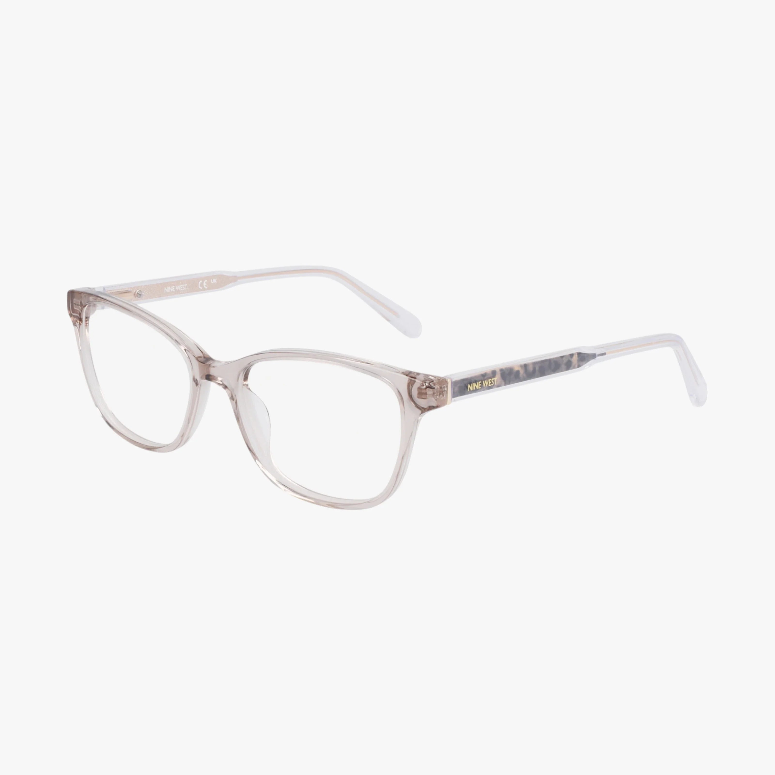 The Nine West NW5216 eyeglasses feature a clear, minimalist rectangular frame with slightly rounded edges and straight temples. Shown on a white background, these modern glasses offer subtle translucency and lasting durability.