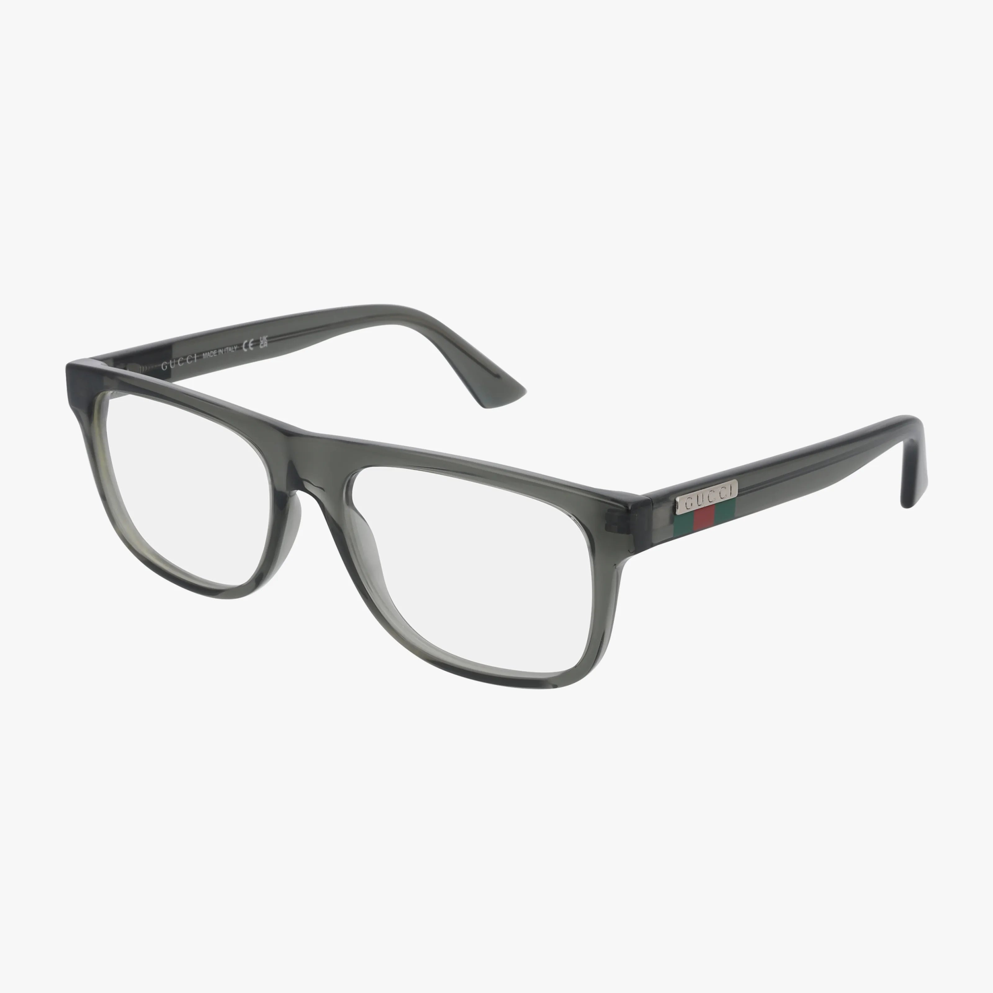 The Gucci GG1117O eyeglasses feature a rectangular, translucent dark gray frame with clear lenses and a small red-green stripe by the hinges—ideal for a stylish look when you buy online.