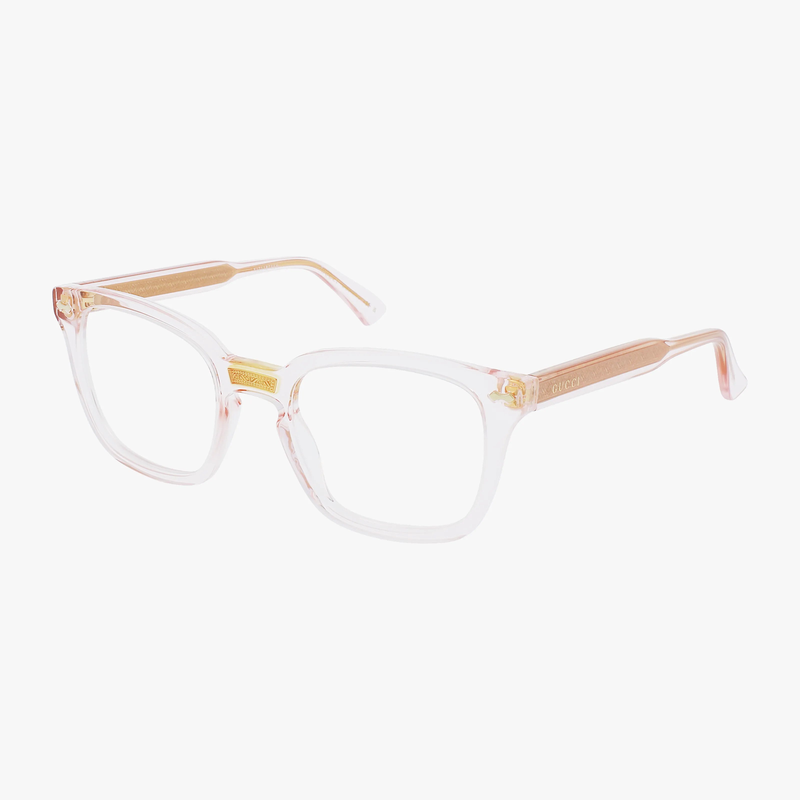 The Gucci GG0184O eyeglasses feature clear, square frames with a hint of pink tint and gold temple accents. Lightweight for all-day comfort, they are displayed angled on a white background.