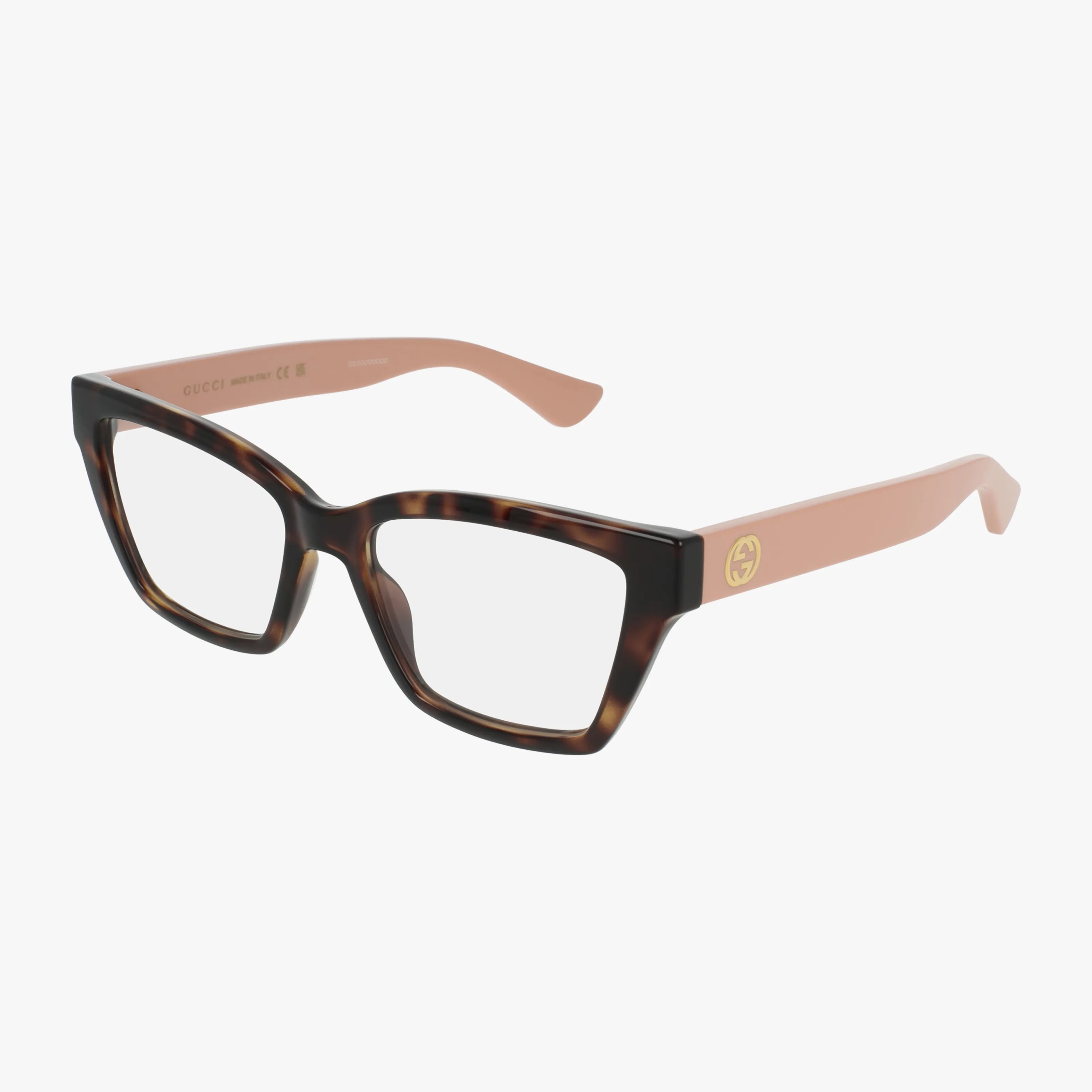 The Gucci GG1715O eyeglasses feature a tortoiseshell front, light pink arms, and a gold Gucci logo on the left hinge. This modern, lightweight frame is displayed against a white background.