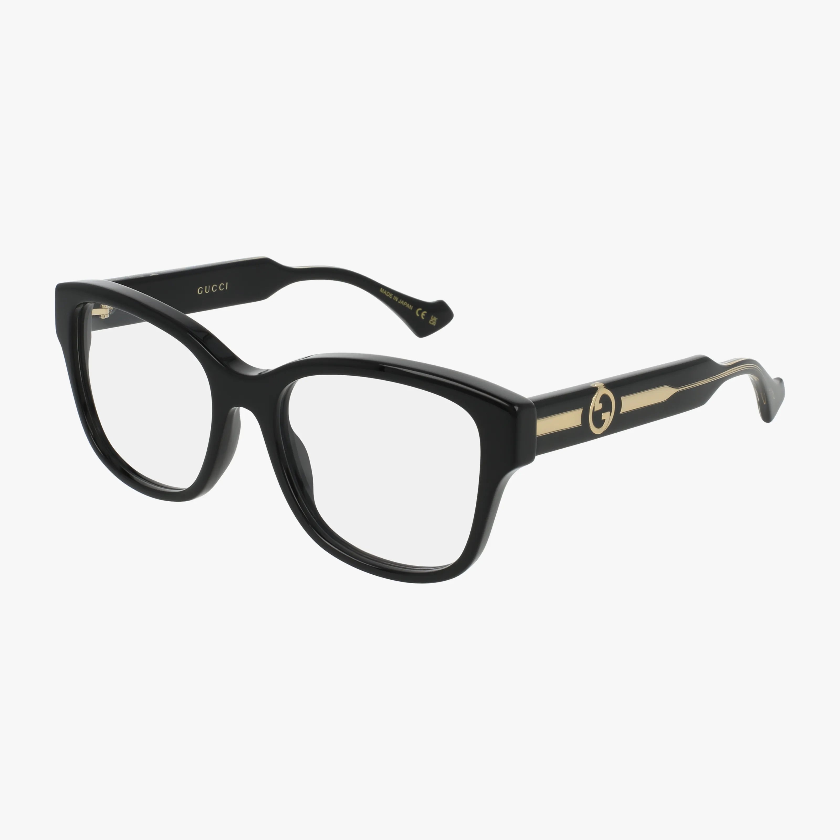 The Gucci GG1775O eyeglasses feature a stylish black frame, clear lenses, and gold Gucci logo detailing on the arms, displayed against a white background.
