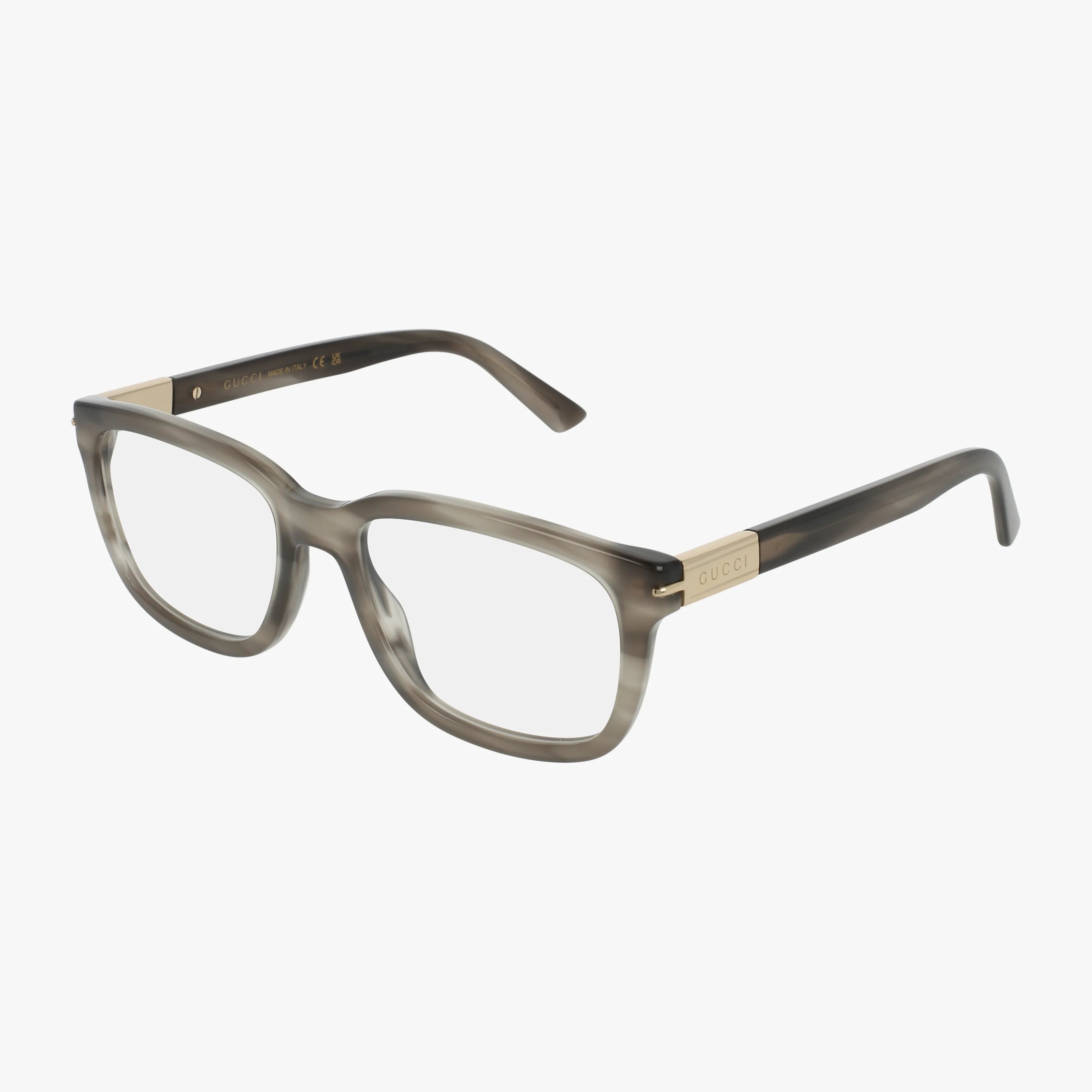 The Gucci GG1776O features stylish rectangular eyeglasses with a grey and black marbled frame, gold accents, and the GUCCI logo on the temples. This bold design is displayed elegantly on a white background.