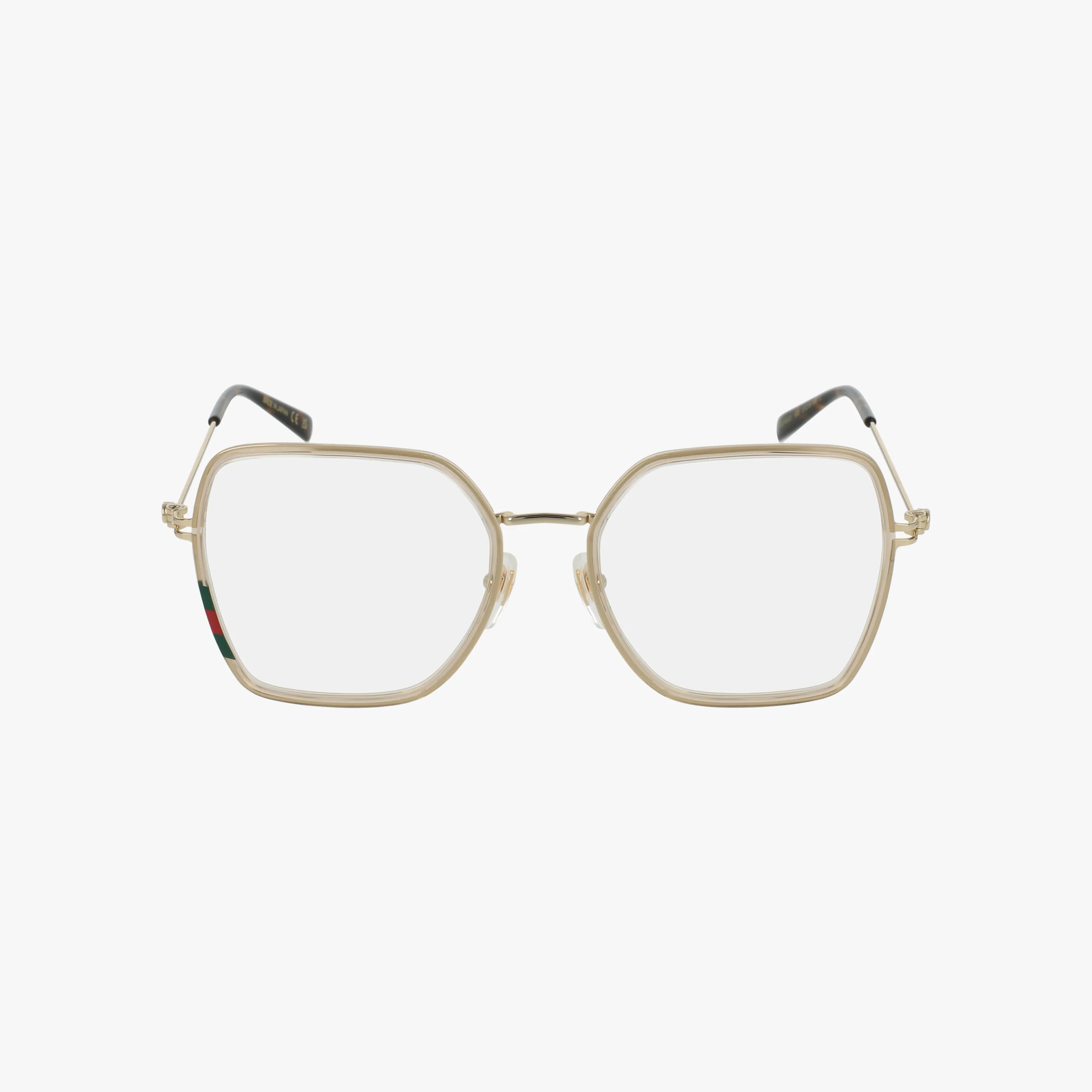 Gucci GG1850O eyeglasses feature gold geometric oversized frames with clear rims, black temple tips, and a green-red stripe on the left arm. Modern, tailored style shown against a plain white background.