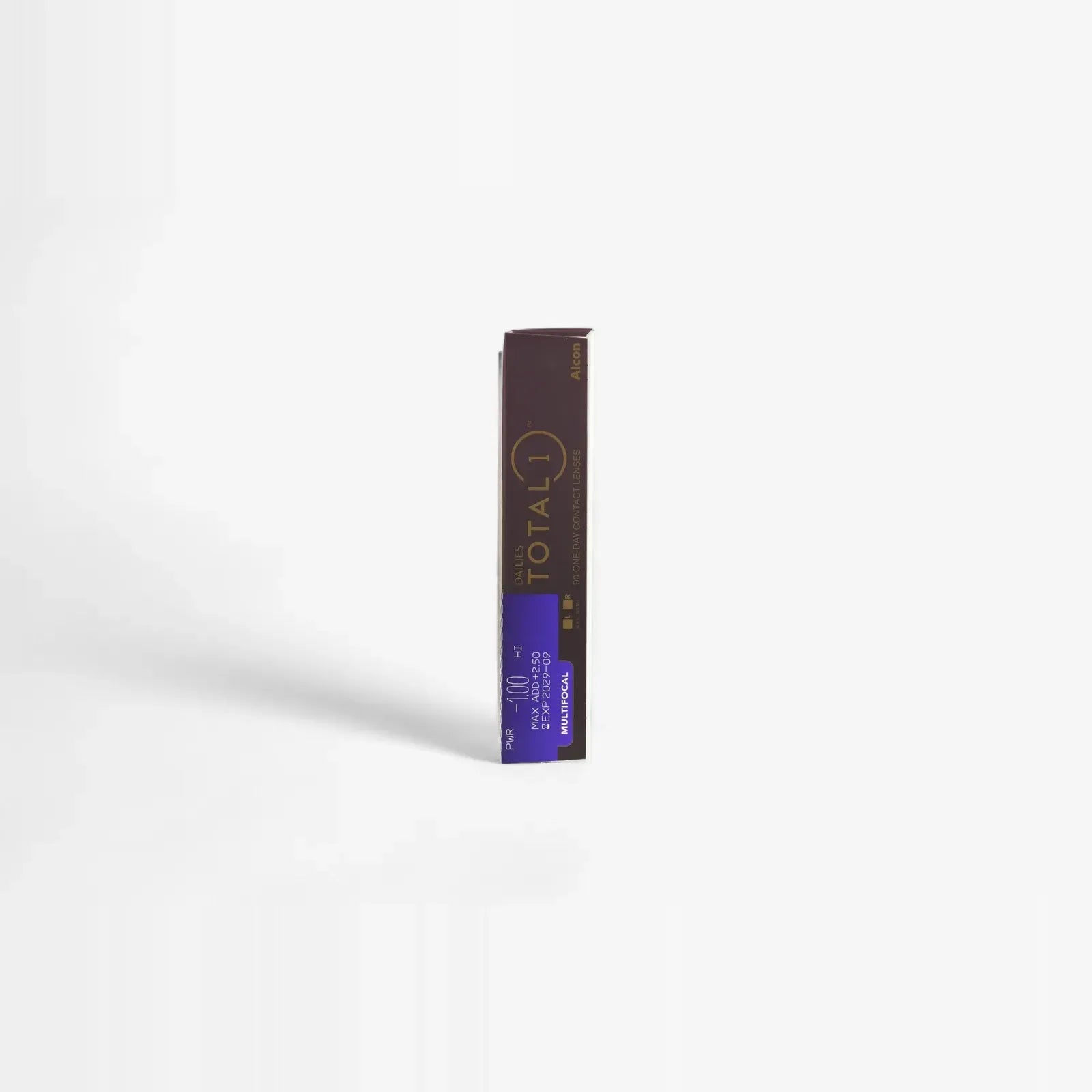 A single dark rectangular box, upright on a white background, labeled Total1 and Dailies in gold and purple—ideal for Dailies Total 1 Multifocal - 90 Pk contact lenses by the brand Total1.