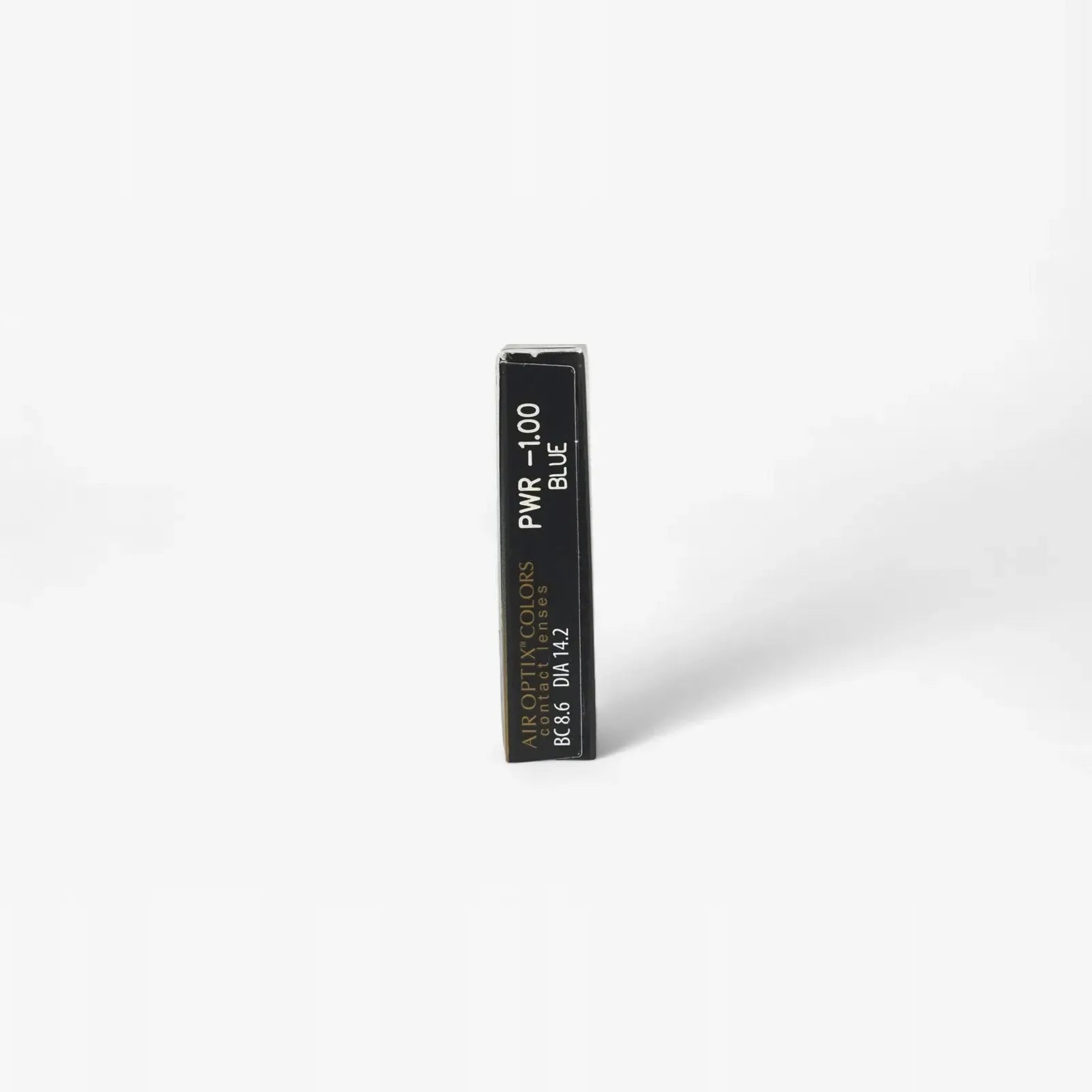 A black rectangular box labeled PWR -1.00 BLUE and APOPTIC COLORS 8-66 DIA14.2 stands upright against a white background, suggesting colored contacts like Air Optix Aqua Colors (Two) - 2 Pk by Air Optix, known for breathable comfort.
