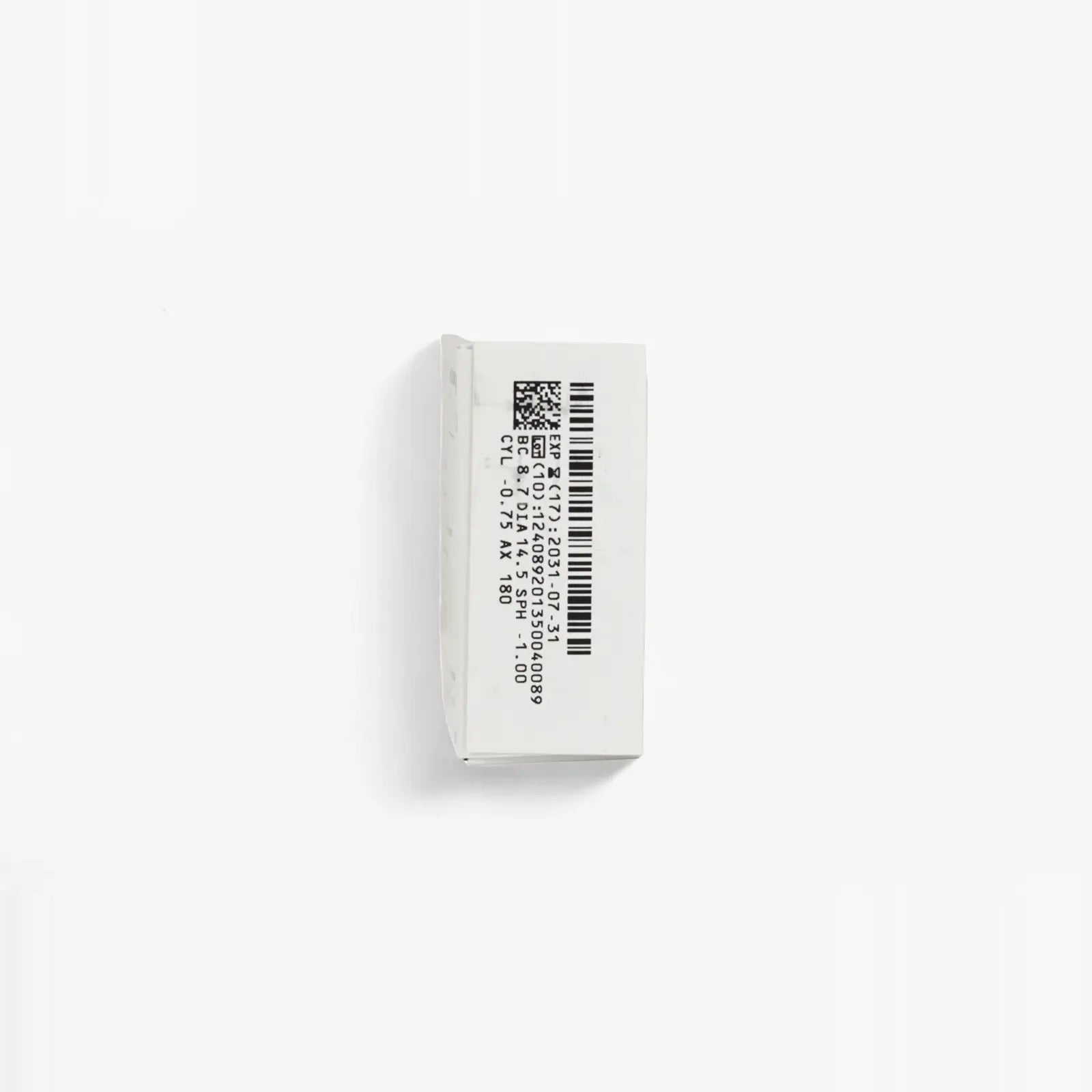 A small white rectangular Biomedics Toric - 6 Pack box from Biomedics, featuring black printed barcodes, numbers, and a QR code on the top, is positioned vertically against a plain white background.