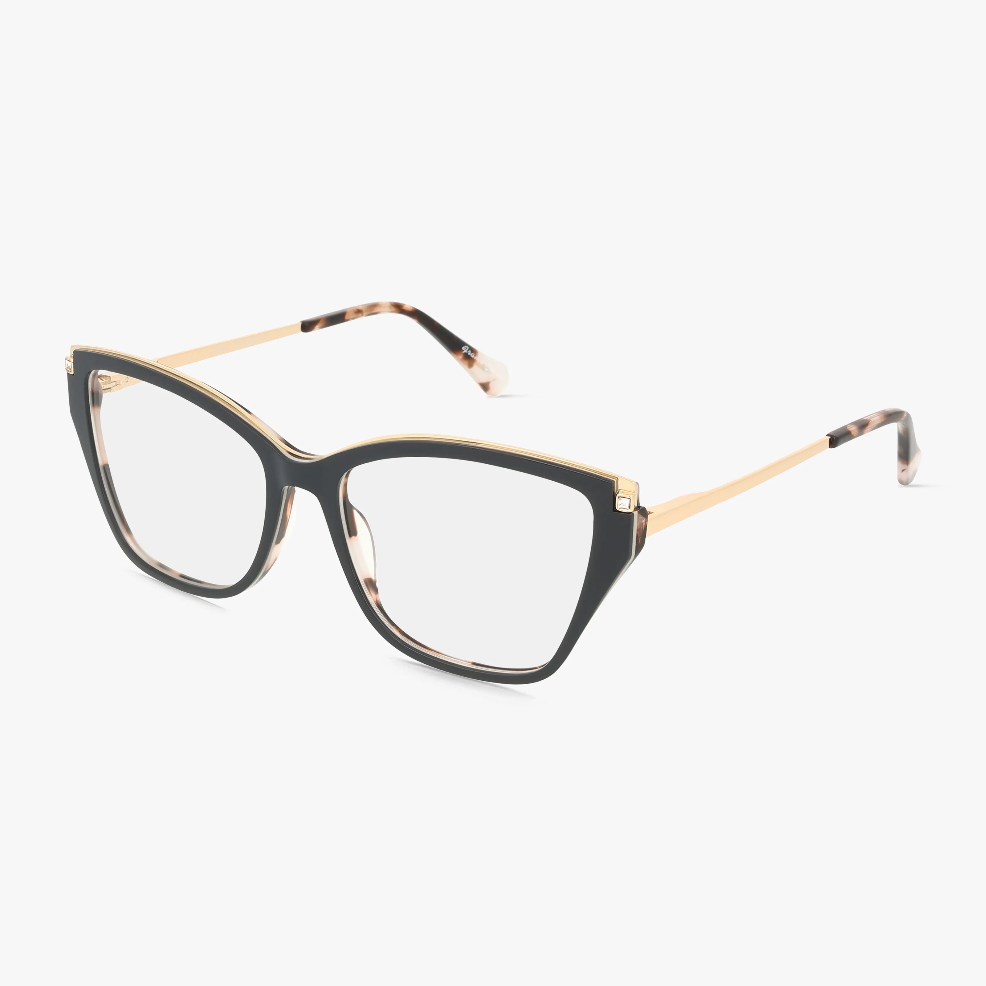 The St. Moritz EMILY eyeglasses in grey feature a chic cat-eye design with transparent lenses and slender gold temples with tortoiseshell tips, offering timeless elegance against a white background.