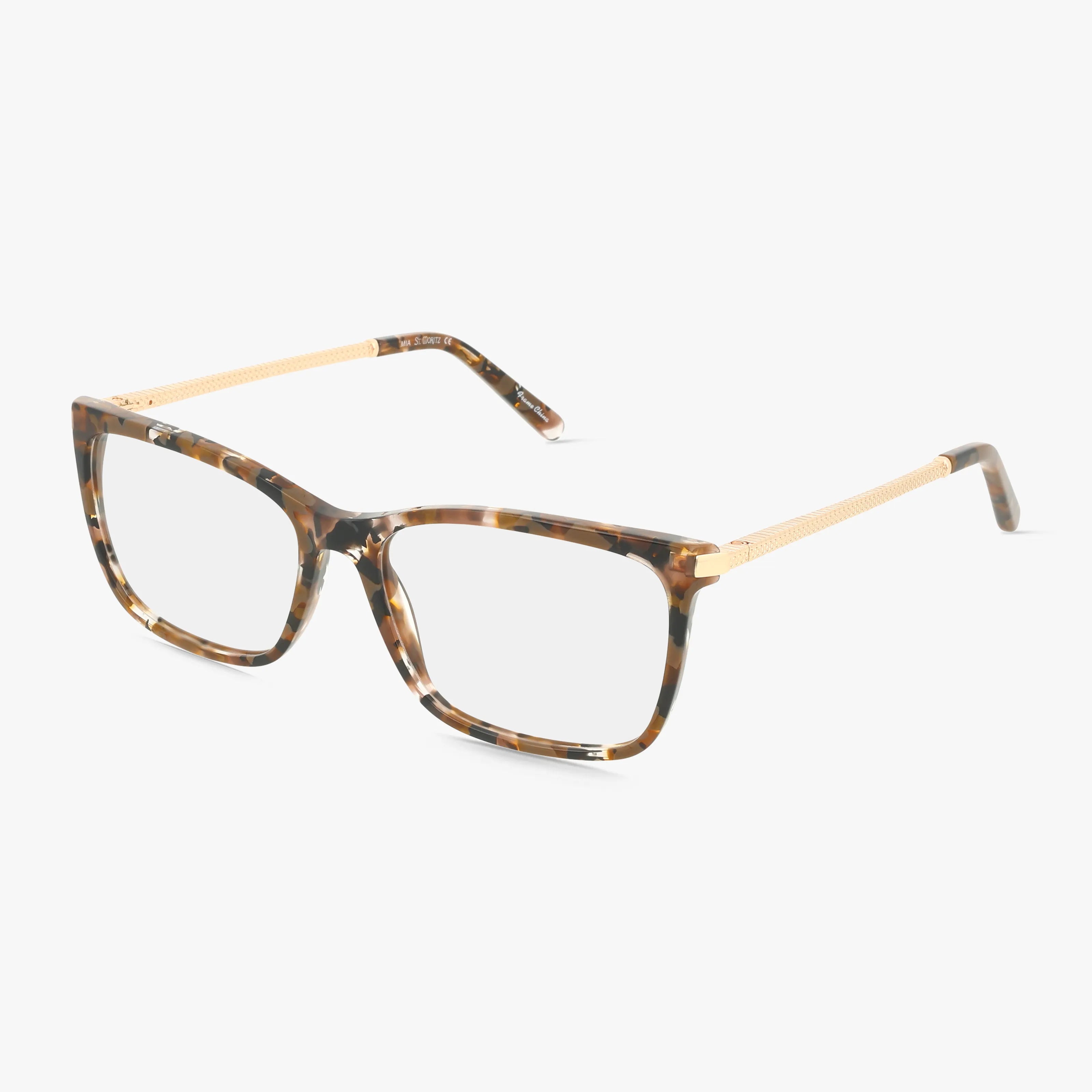 The St. Moritz MIA eyeglasses feature square brown multicolor frames with gold textured temples, offering a resilient build and modern style, shown against a white background.