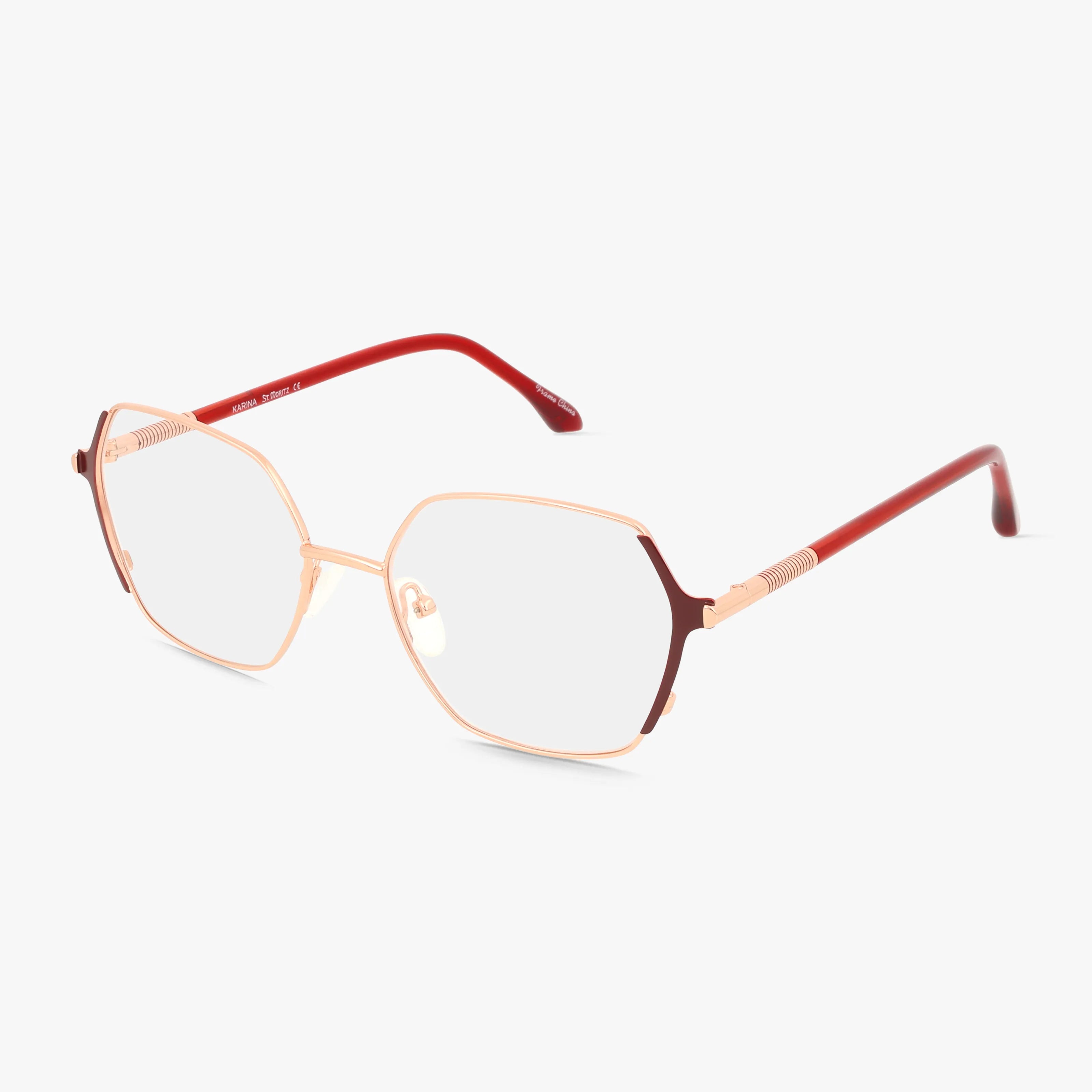 The St. Moritz KARINA features geometric, rose gold metal frames with slightly oversized lenses and red temples accented in metal, combining modern style and durability.