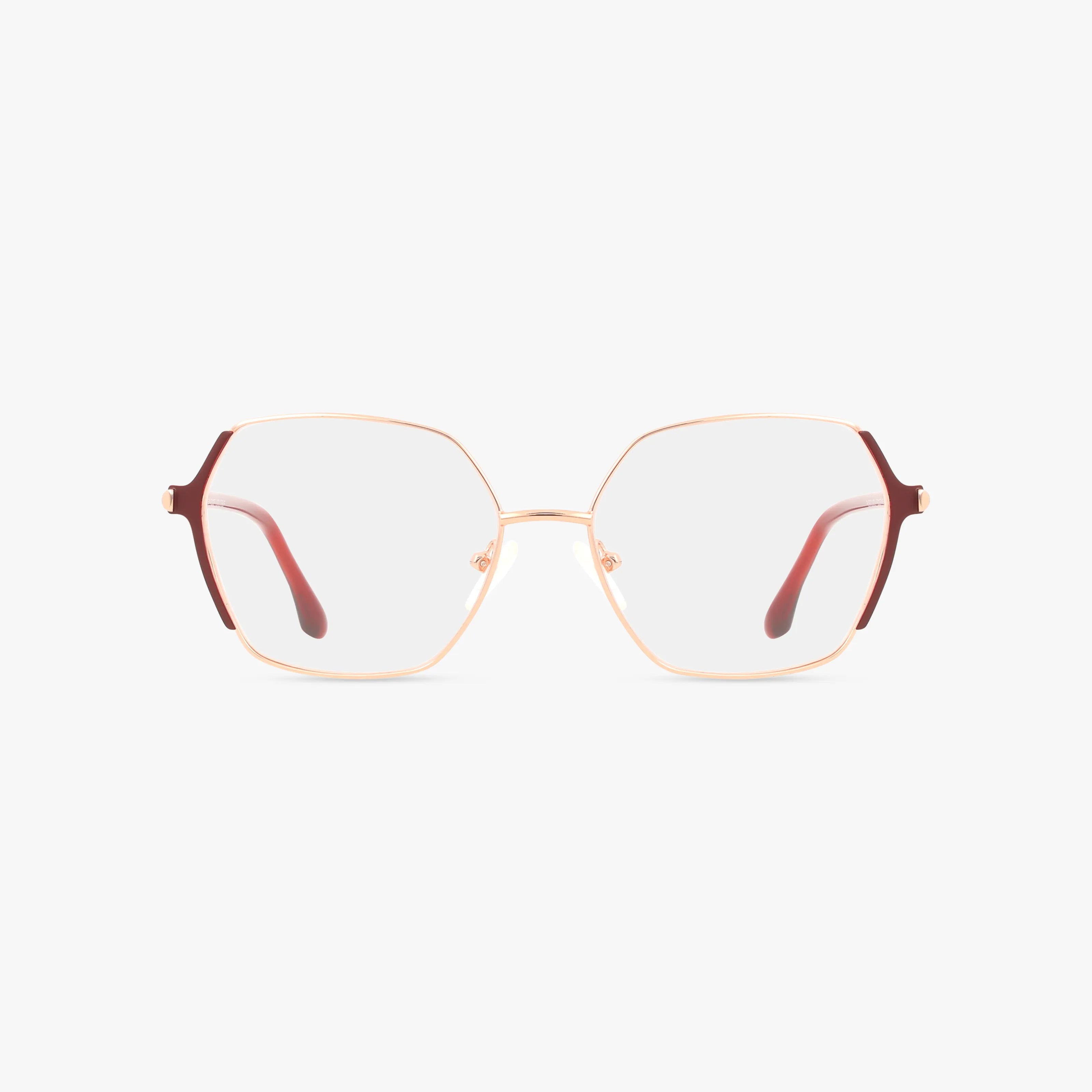 The KARINA eyeglasses by St. Moritz feature large geometric gold frames with thin reddish-brown arms and a minimalist design, offering a sleek look, shown against a plain white background.