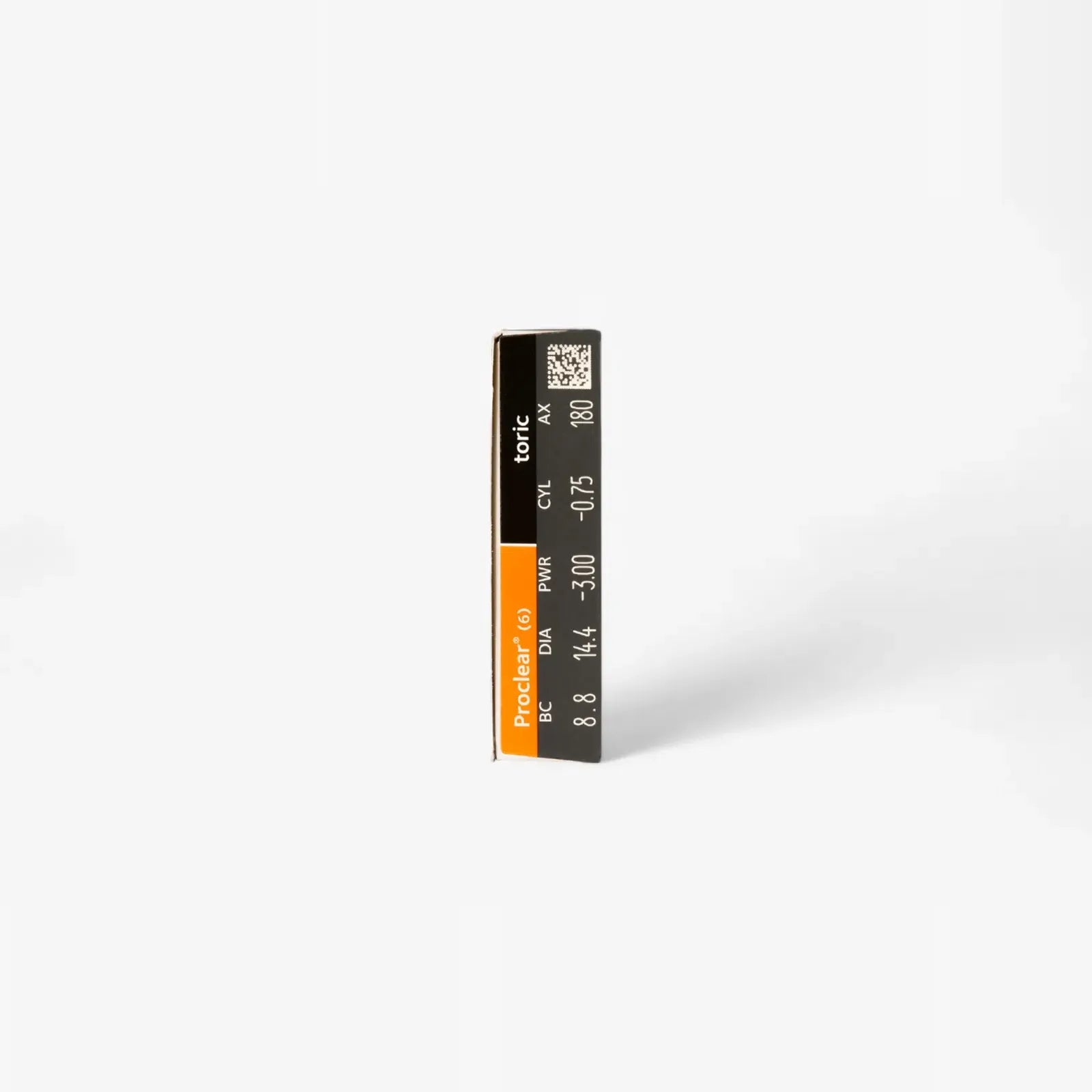 A rectangular box with a black and orange label reading “Proclear Toric XR - 6 Pack” by Proclear, showing specifications and a QR code on the side, stands upright against a plain white background.