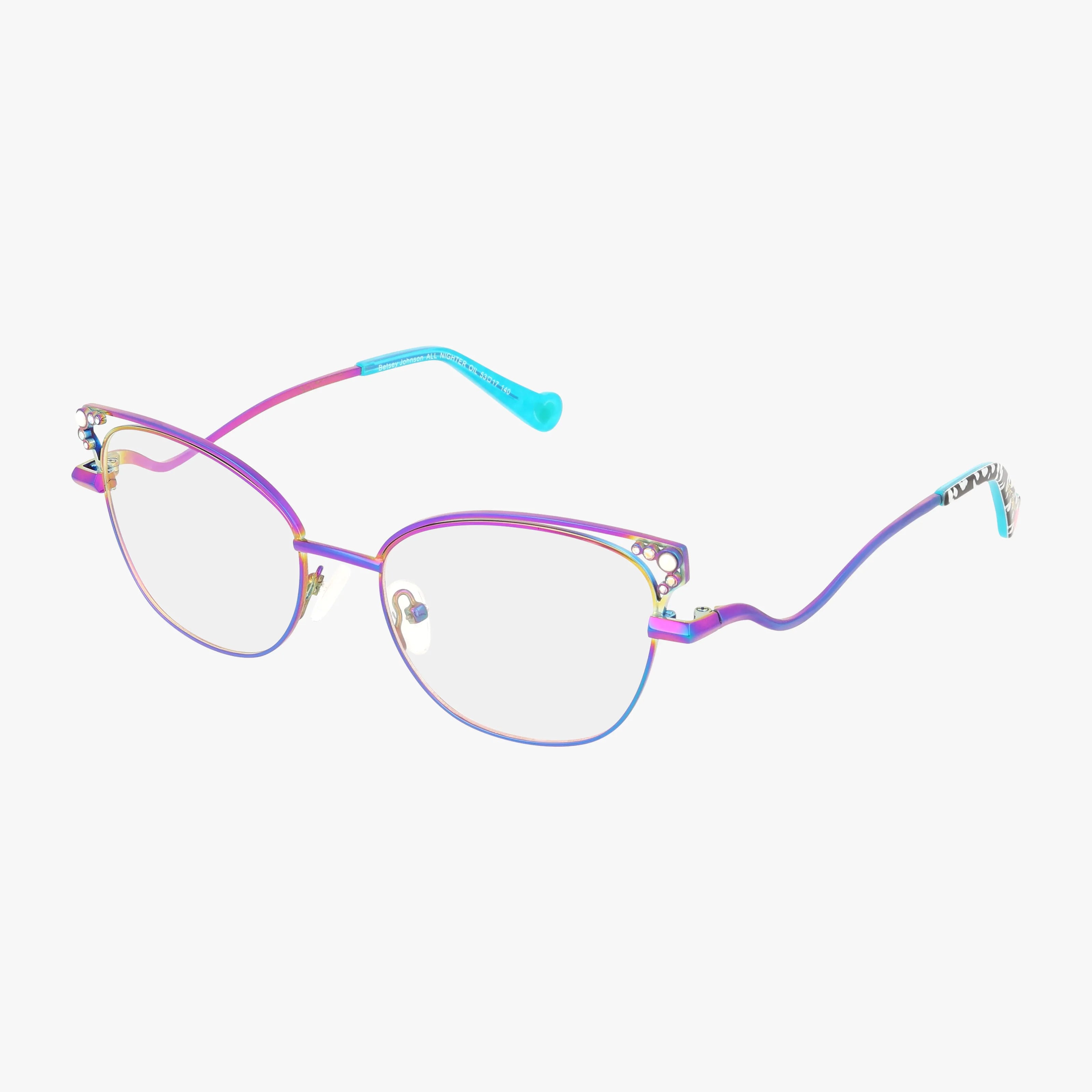 Betsey Johnson’s ALL NIGHTER cat-eye glasses add a playful touch with a multicolor gradient, decorative cutouts, and wavy arms with blue tips.