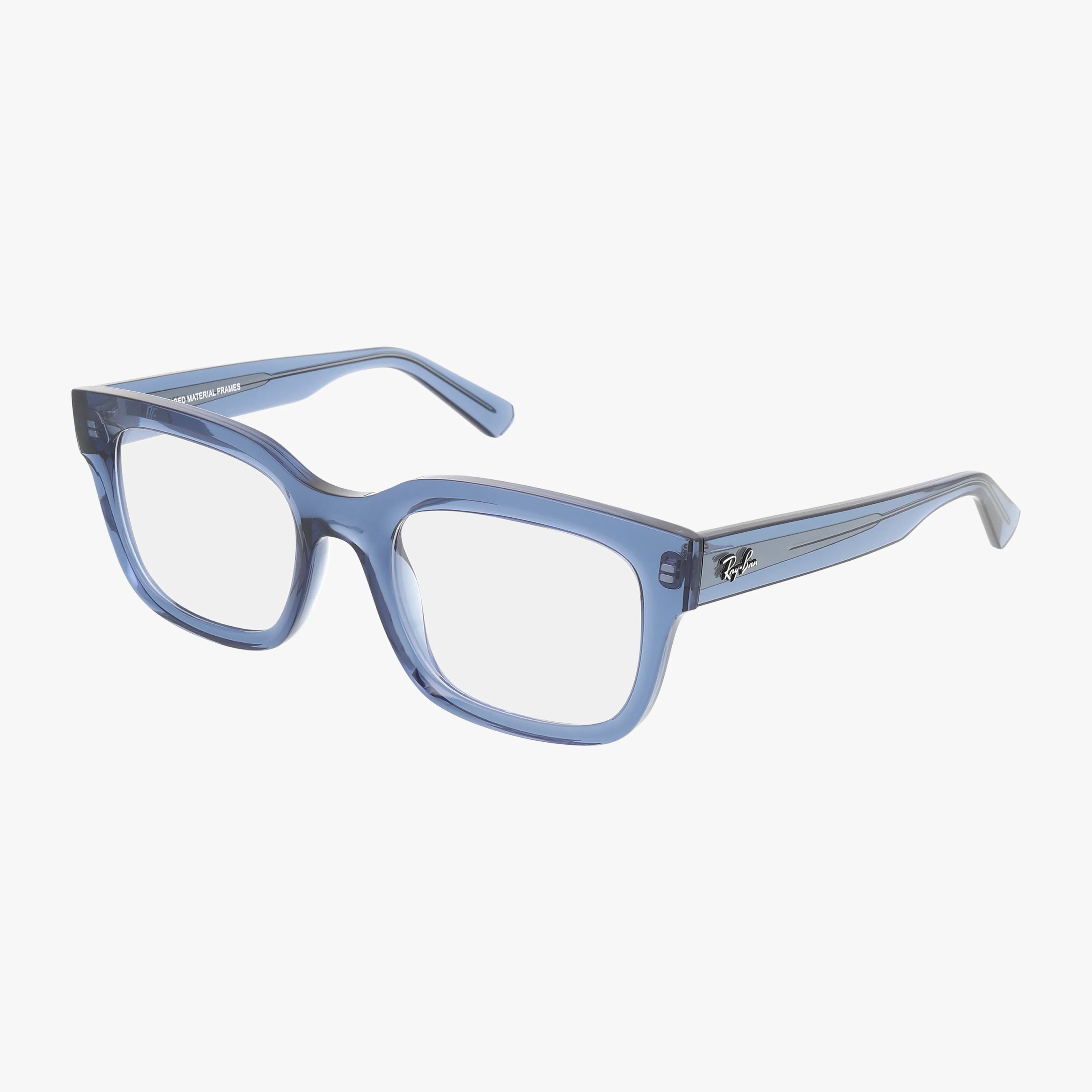 Ray-Ban RX7217 CHAD eyeglasses in clear blue, featuring thick rectangular frames with transparent progressive lenses and small silver accents on the arms, set against a white background.