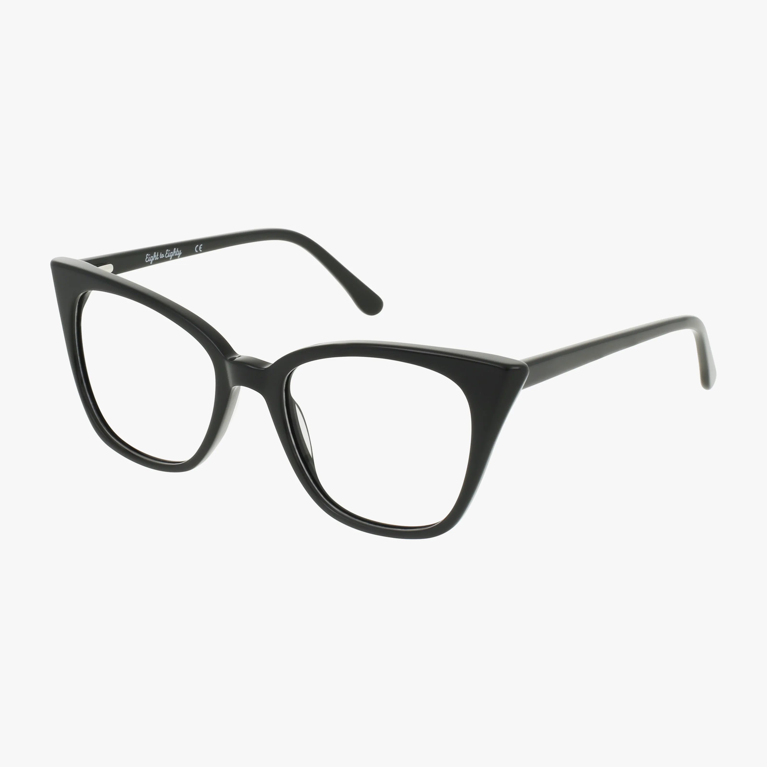 The CHANTEL by Eight To Eighty features black cat-eye thick frames, elegantly displayed at an angle on a white background—a stylish and versatile choice ideal for prescription lenses.