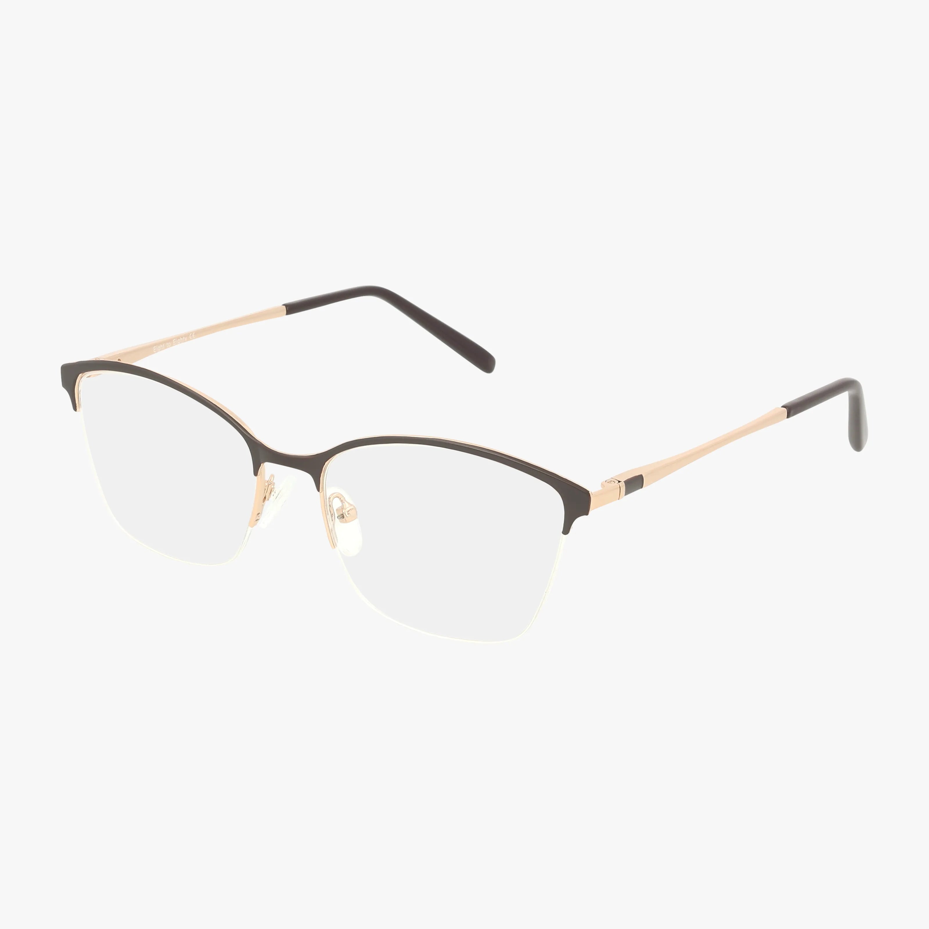 The ANNIE by Eight To Eighty features a stylish brown frame with thin metal on top, classic lines, clear Transitions lenses, nose pads, and slim gold arms with black tips. Set against a white background.