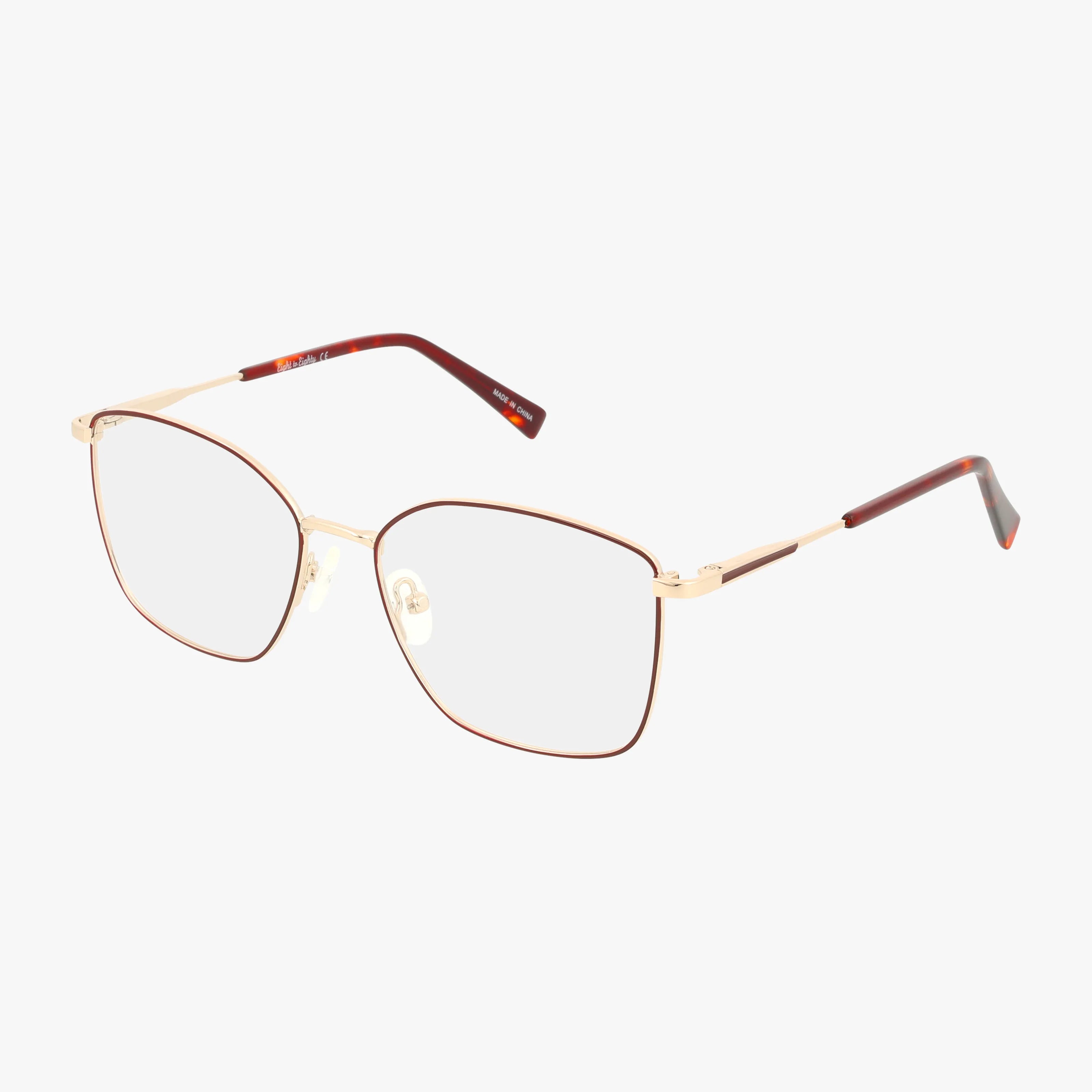 The GOLDIE by Eight To Eighty features square gold frames, clear lenses, adjustable nose pads, and tortoiseshell temple tips—offering a modern take on classic style, shown on a white background.