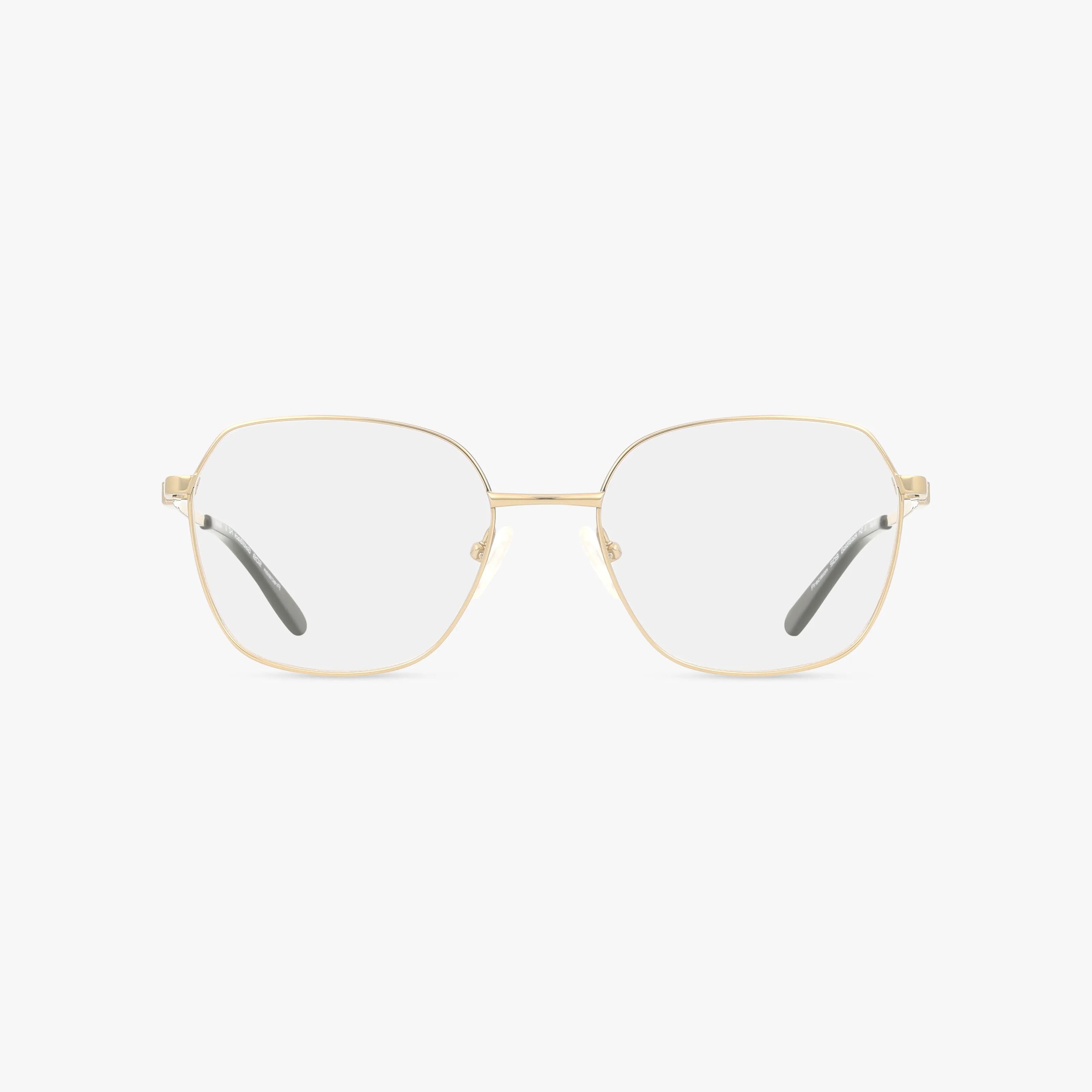 The Precision 509 eyeglasses feature thin, gold, hexagonal metal frames with clear lenses and black-tipped temples. Displayed on a plain white background, these glasses blend bold style with everyday excellence.