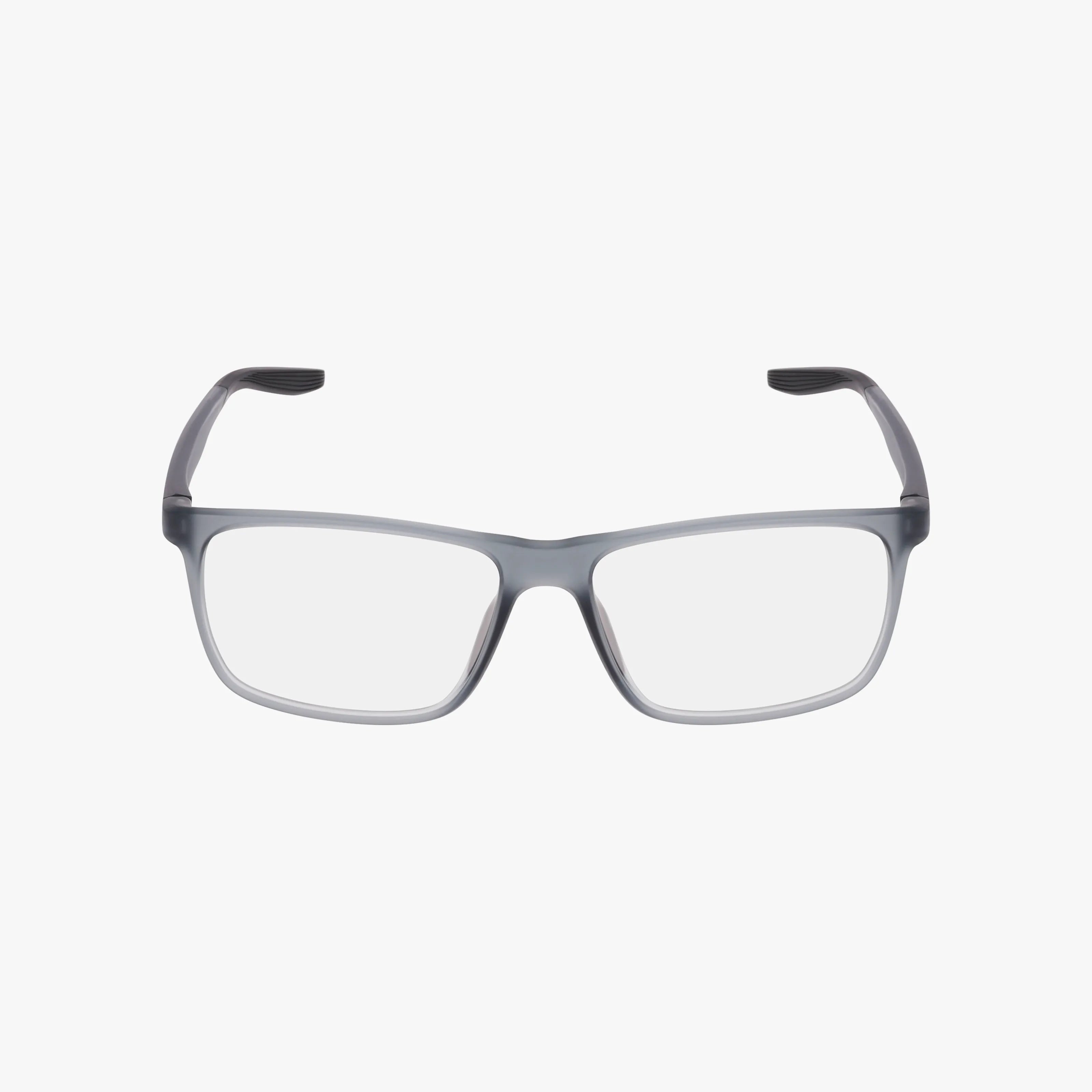 The NIKE 7116 by Nike are rectangular eyeglasses with transparent gray frames and clear lenses, offering a versatile style that suits both streetwear and office looks, displayed on a plain white background.