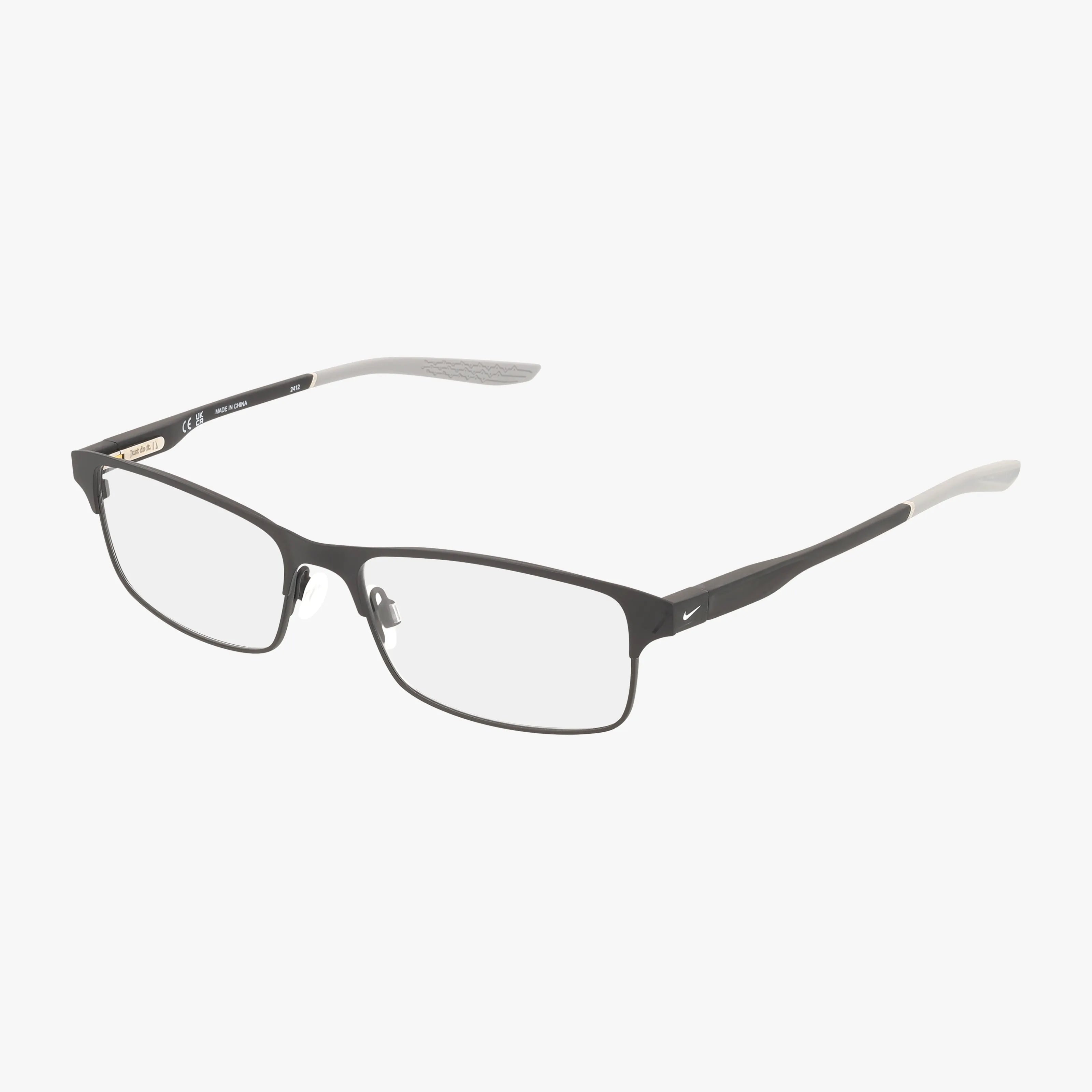 The NIKE 8046 by Nike features rectangular black matte frames with thin rims and clear blue light lenses, accented subtly in silver with white-tipped temple arms—ideal for daily wear, shown against a white background.