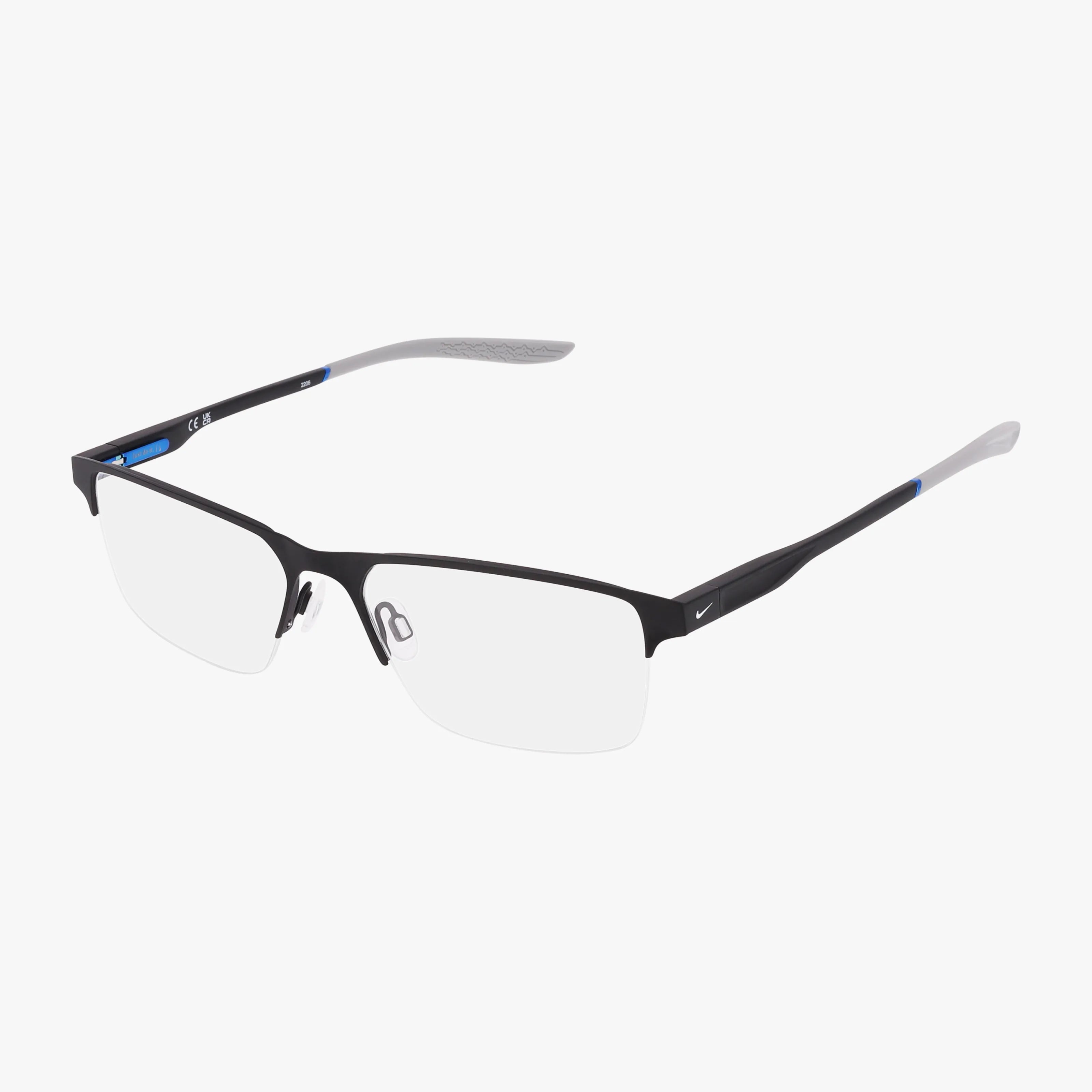 The NIKE 8045 by NIKE features rimless rectangular eyeglasses with a lightweight frame, black accents, silver temples, and subtle blue details—ideal for daily wear and shown against a white background.