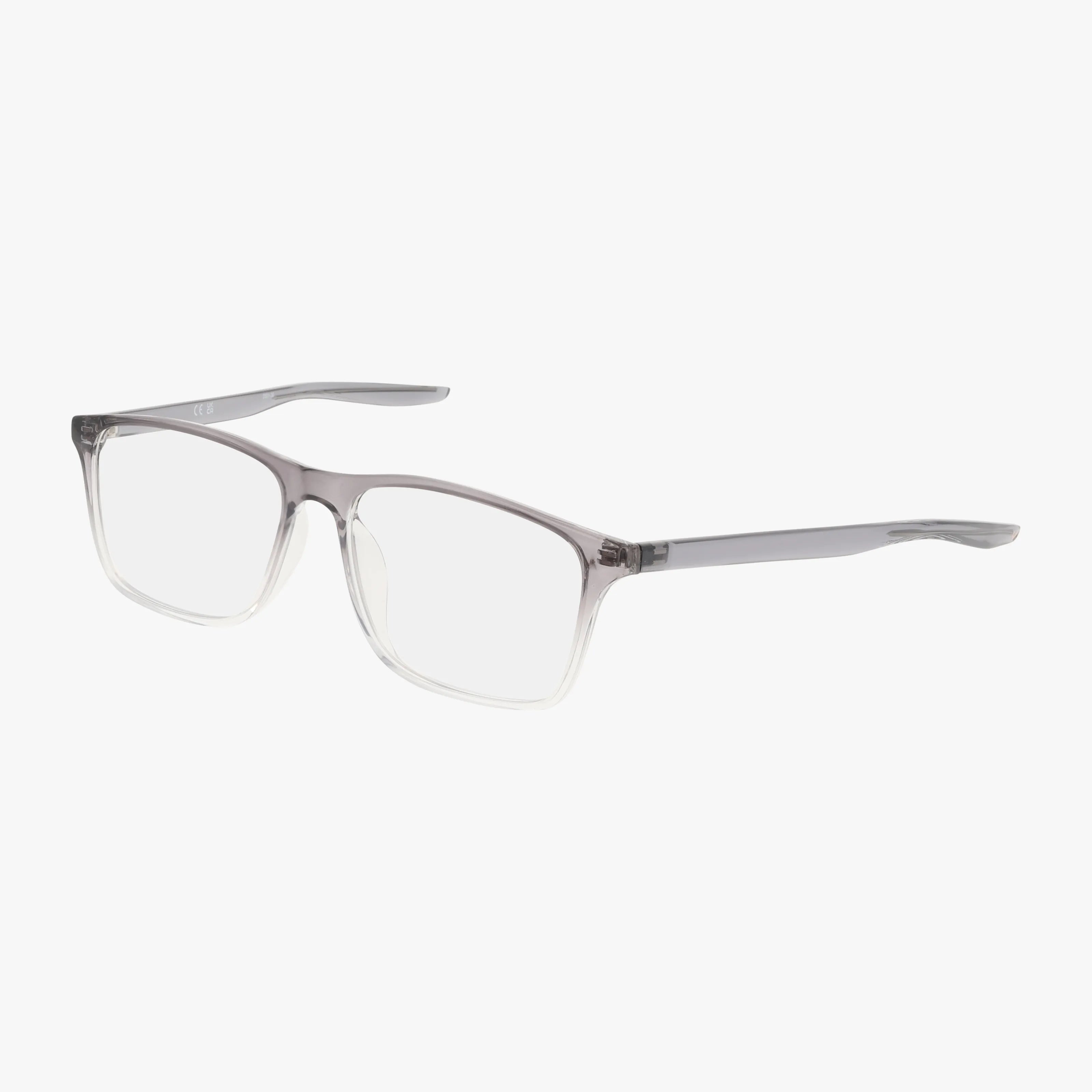 The NIKE 7125 by Nike features a rectangular shape with clear lenses and a Grey Clear semi-transparent frame that fades to clear at the bottom, plus slender matching temples. Shown on white. Personalized lens options available.