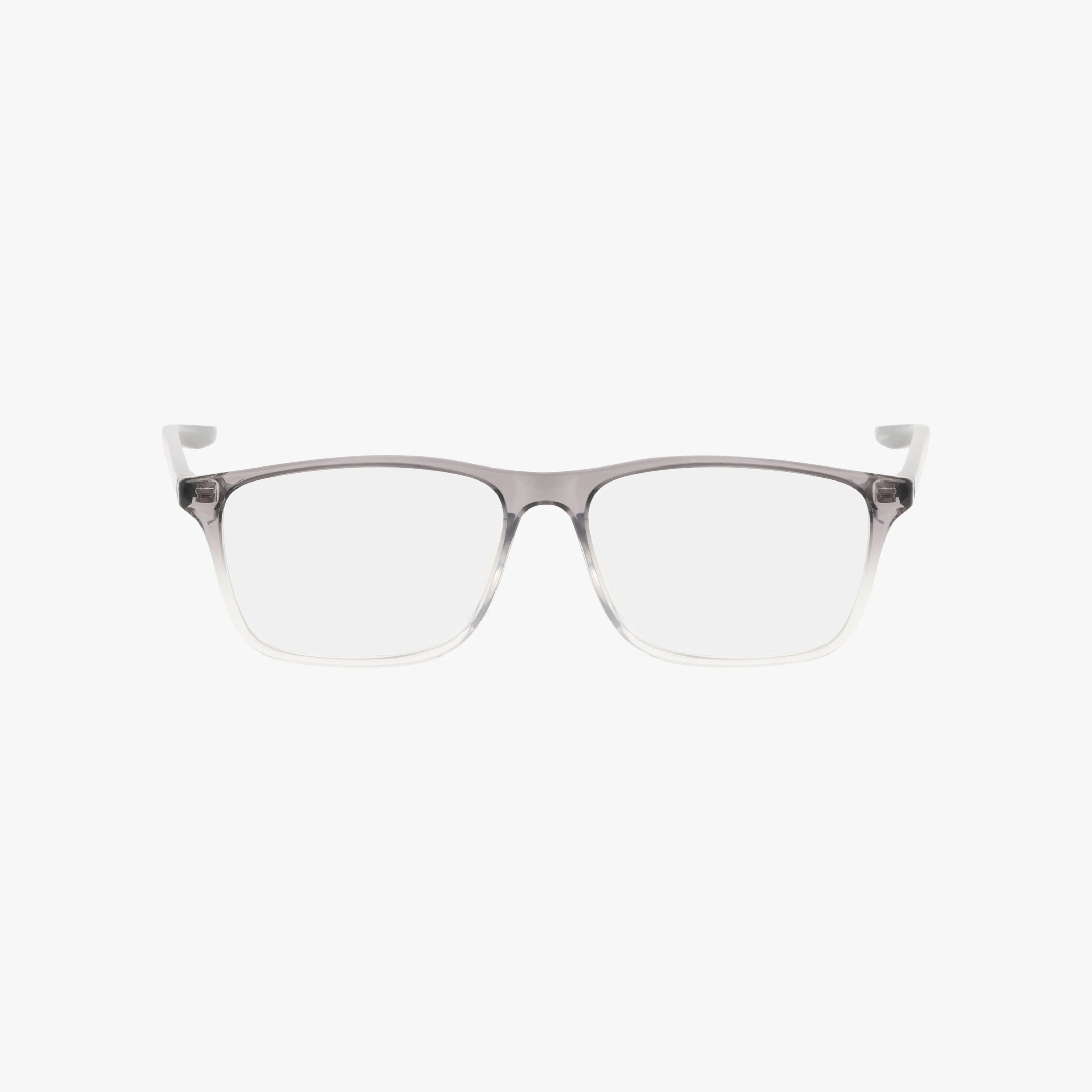 The Nike 7125 eyeglasses showcase clear rectangular frames fading from dark gray to transparent, set against a white background. Discover custom lens options with vision insurance available online.