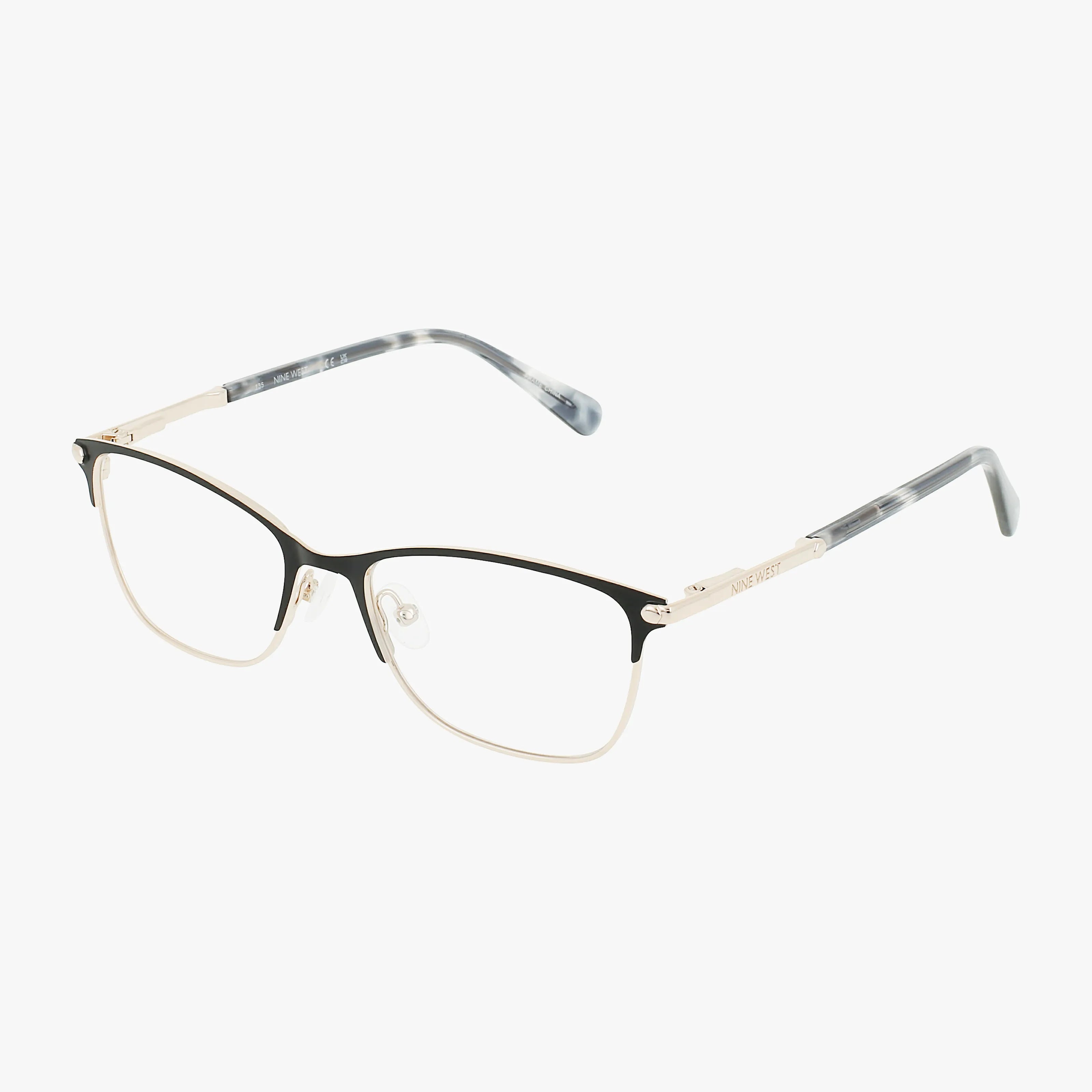 The Nine West NW8013N eyeglasses feature thin, rectangular black gold frames, clear lenses, and subtly patterned gray and white temples. Transparent adjustable nose pads add sharp sophistication to this stylish look.