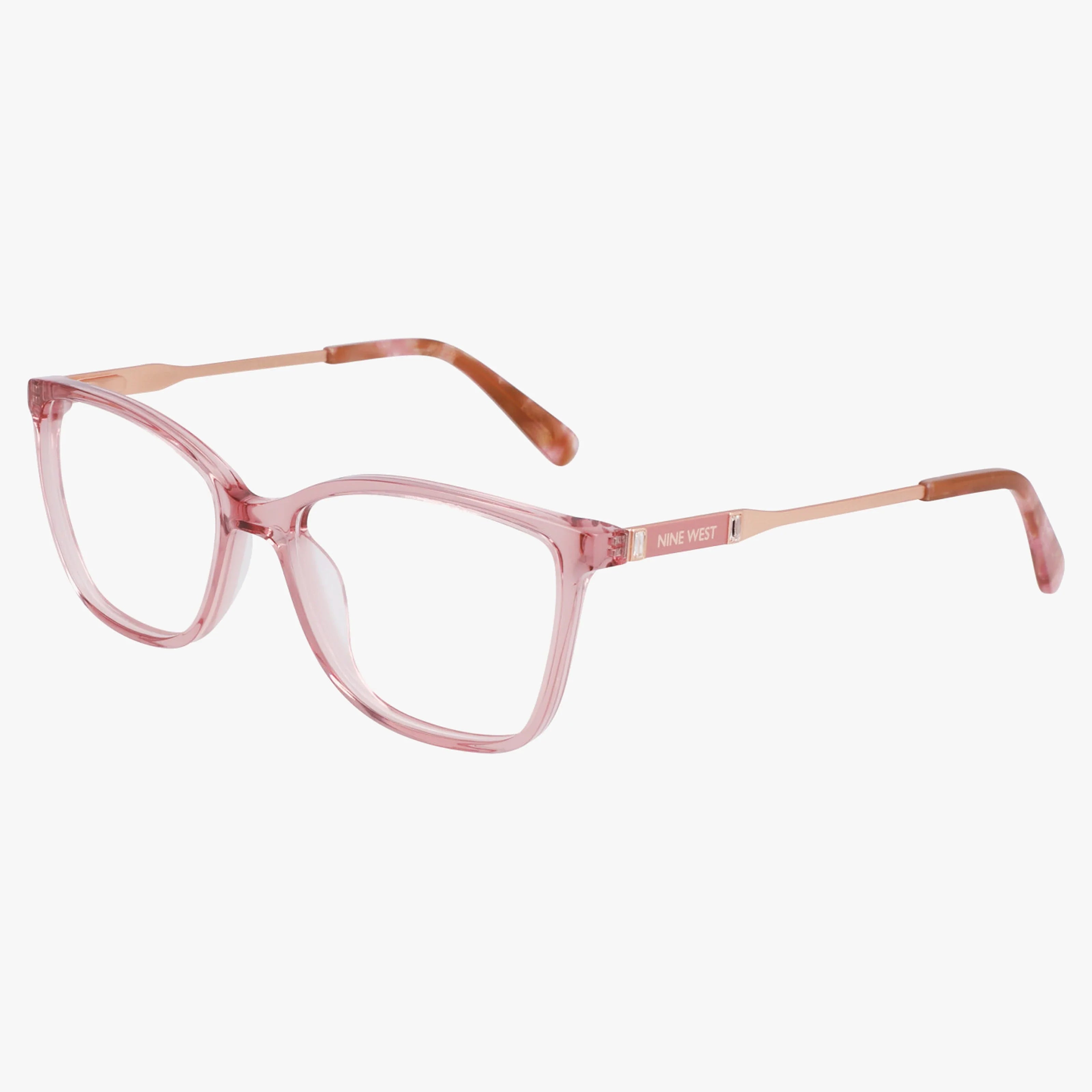 The Nine West NW5220N eyeglasses feature a lightweight, stylish Pink Clear frame with slim rose gold arms. The Nine West logo appears on the left arm. Eyewear is set against a plain white background.