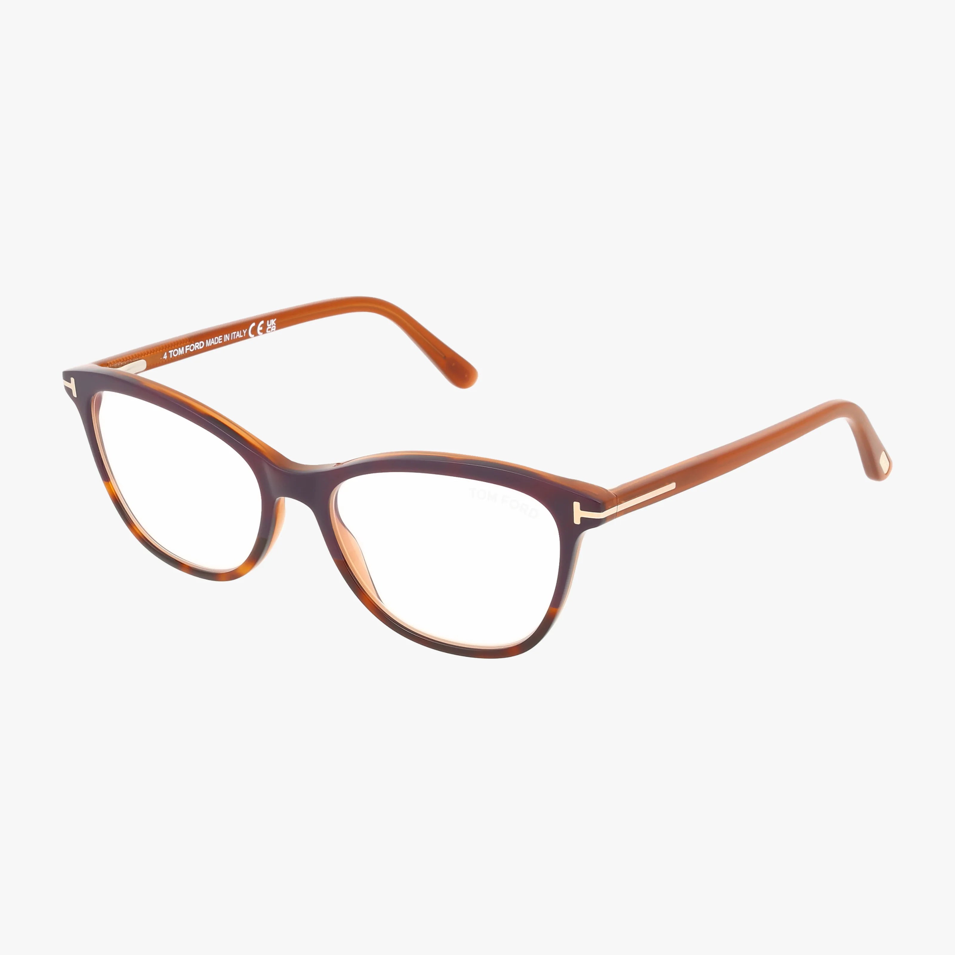 The Tom Ford FT5636-B eyeglasses feature a brown tortoiseshell cat-eye shape with thin arms for a modern, stylish look, shown here on a white background.