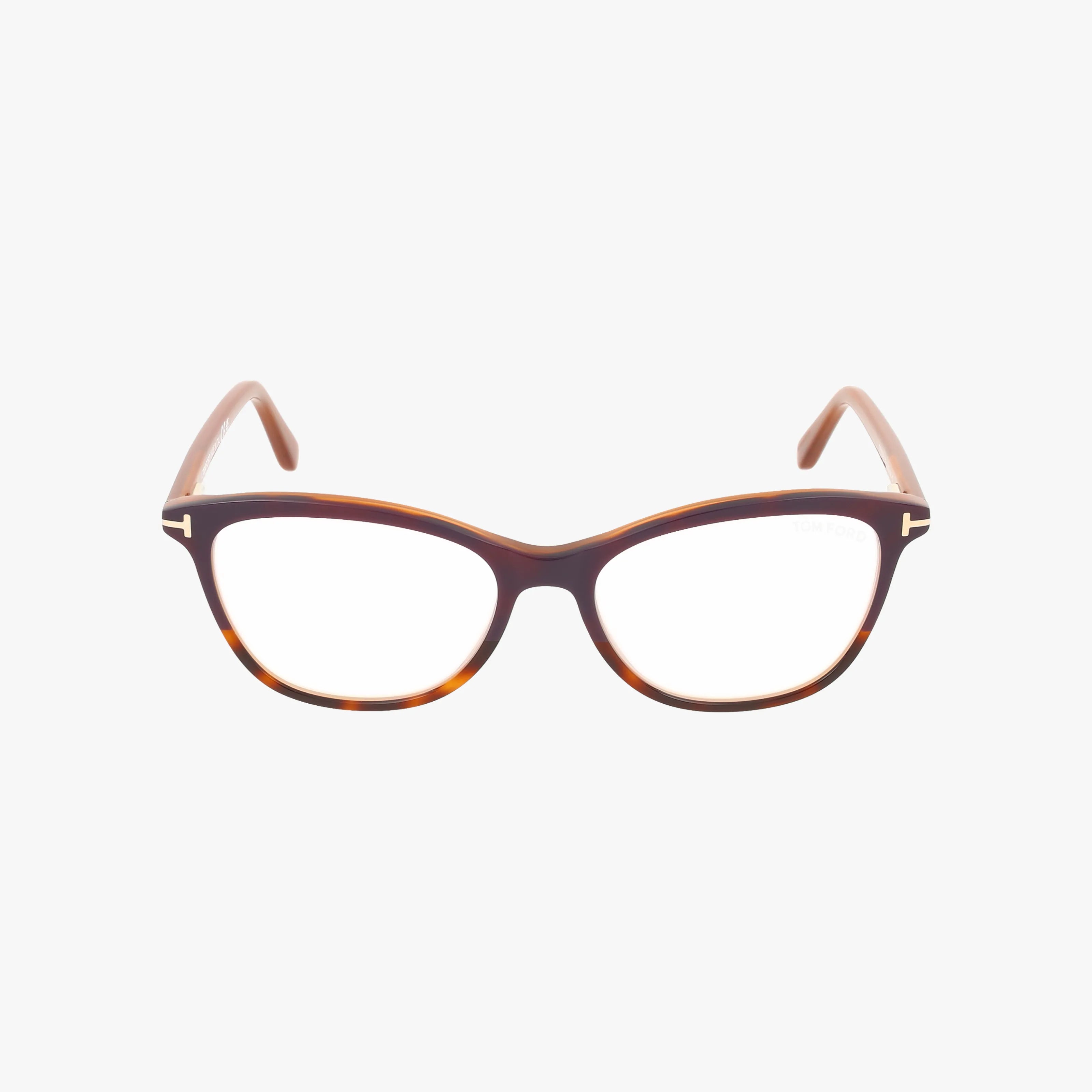 The Tom Ford FT5636-B eyeglasses feature brown tortoiseshell rounded rectangular frames with gently curved arms, blending modern and classic style. Displayed elegantly on a white background, these frames offer timeless appeal.