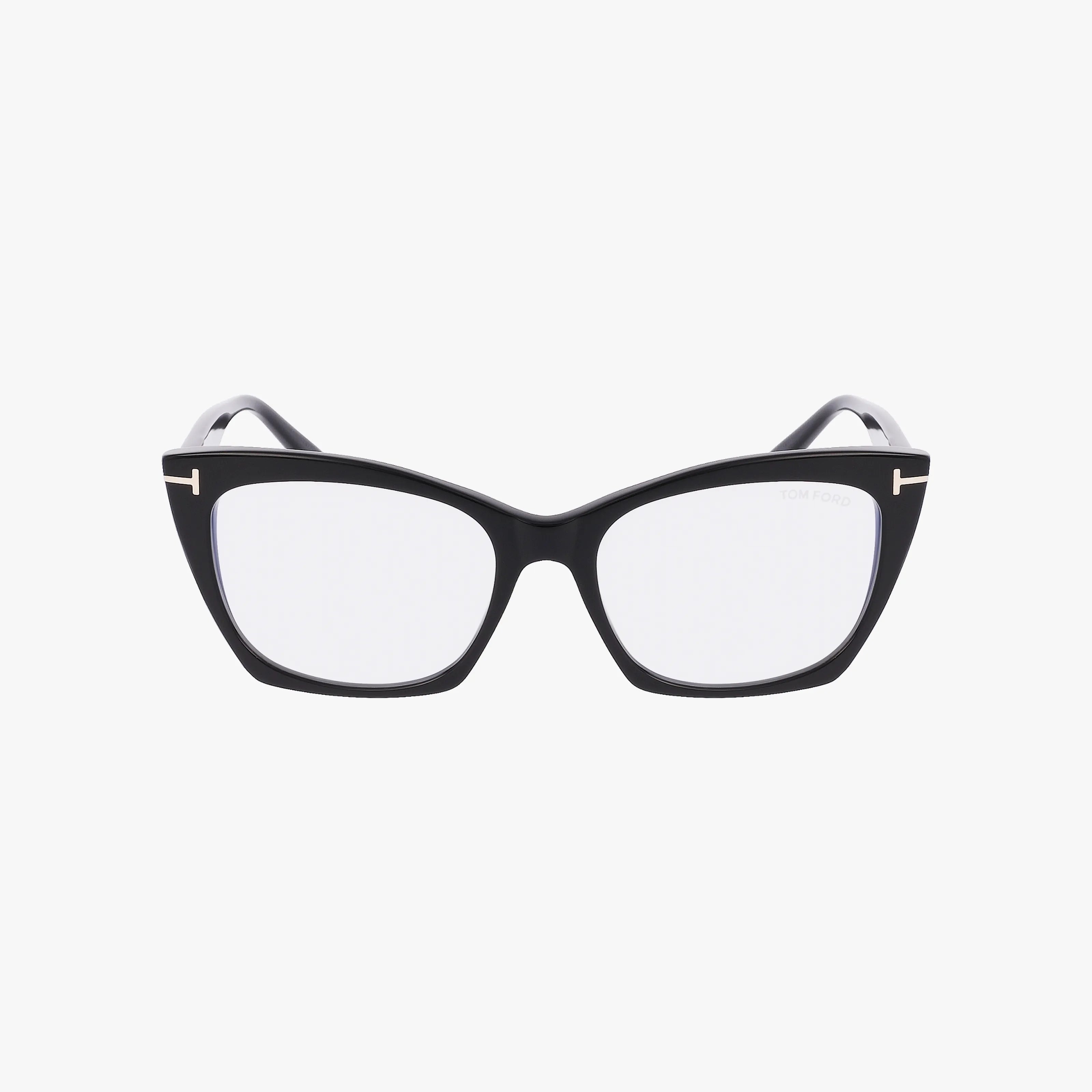 Tom Ford FT5709-B cat-eye eyeglass frames feature clear lenses, a slight upward curve at the outer edges, and subtle metallic accents on the front corners—blending chic style with visual comfort.