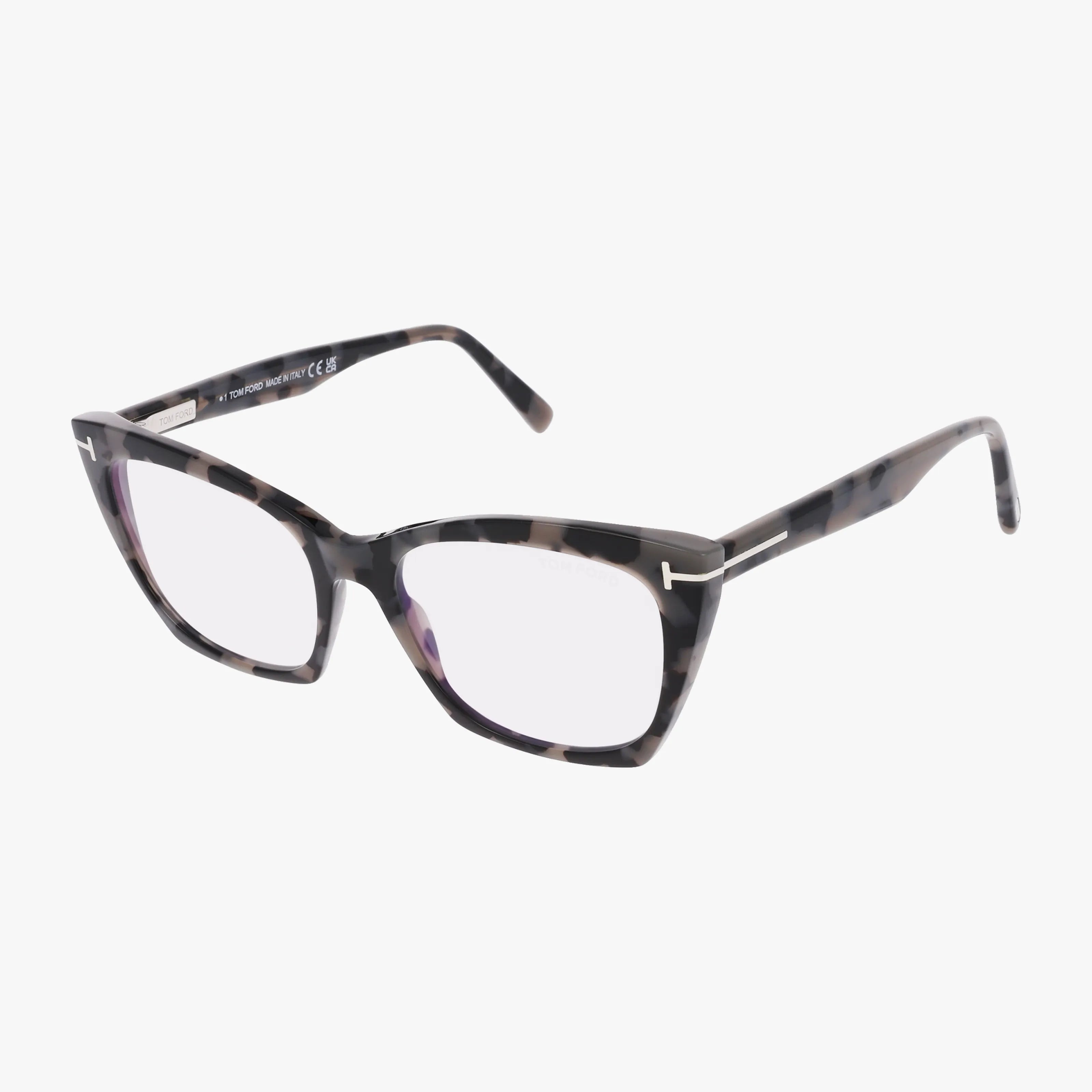 The Tom Ford FT5709-B features a chic cat-eye shape in dark tortoiseshell with silver temple accents—stylish, durable frames displayed on a white background.