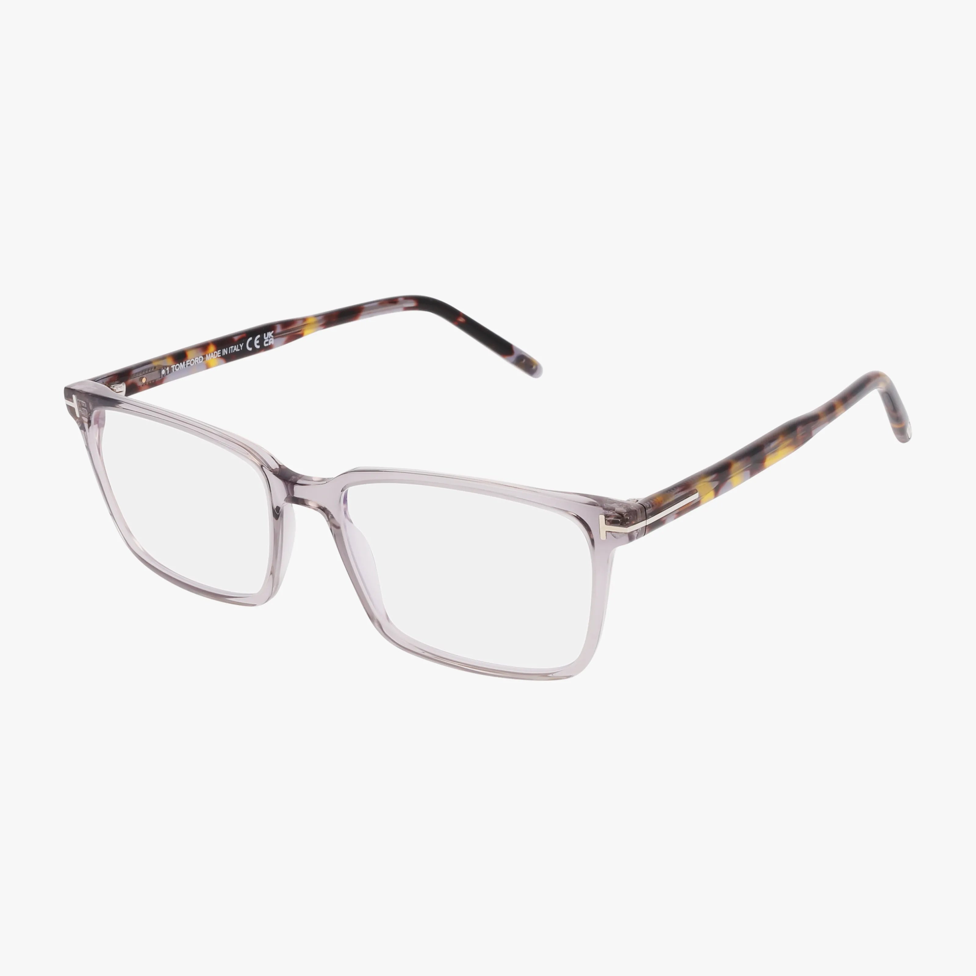 Tom Ford FT5802-B rectangular eyeglasses feature a transparent front and tortoiseshell-patterned arms, offering a classic, stylish look—ideal for those seeking fashionable eyewear online. Displayed on a white background.
