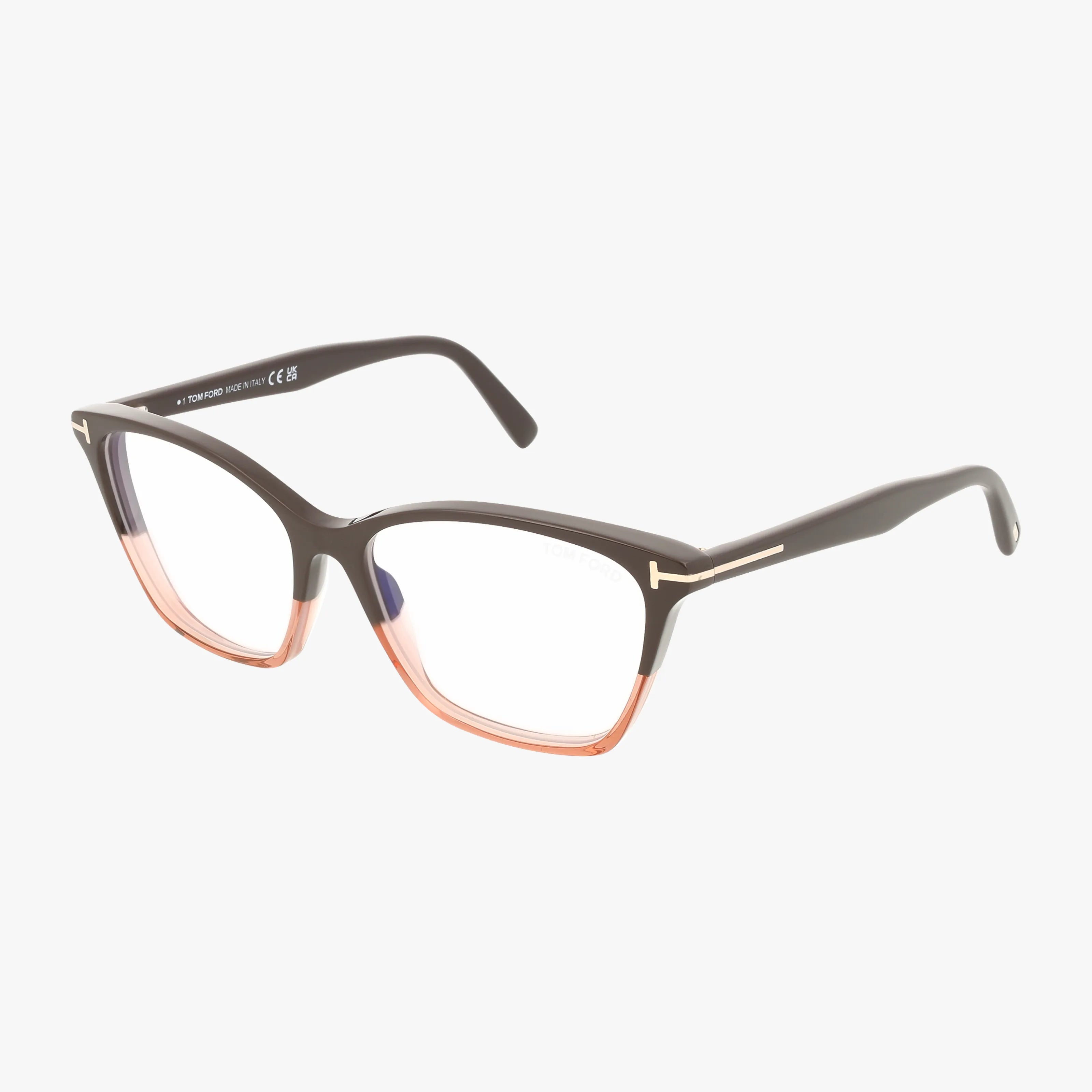 The Tom Ford FT5949-B eyeglasses feature black frames that fade into translucent pink at the bottom, with gold-accented temples. These designer glasses are showcased against a plain white background.