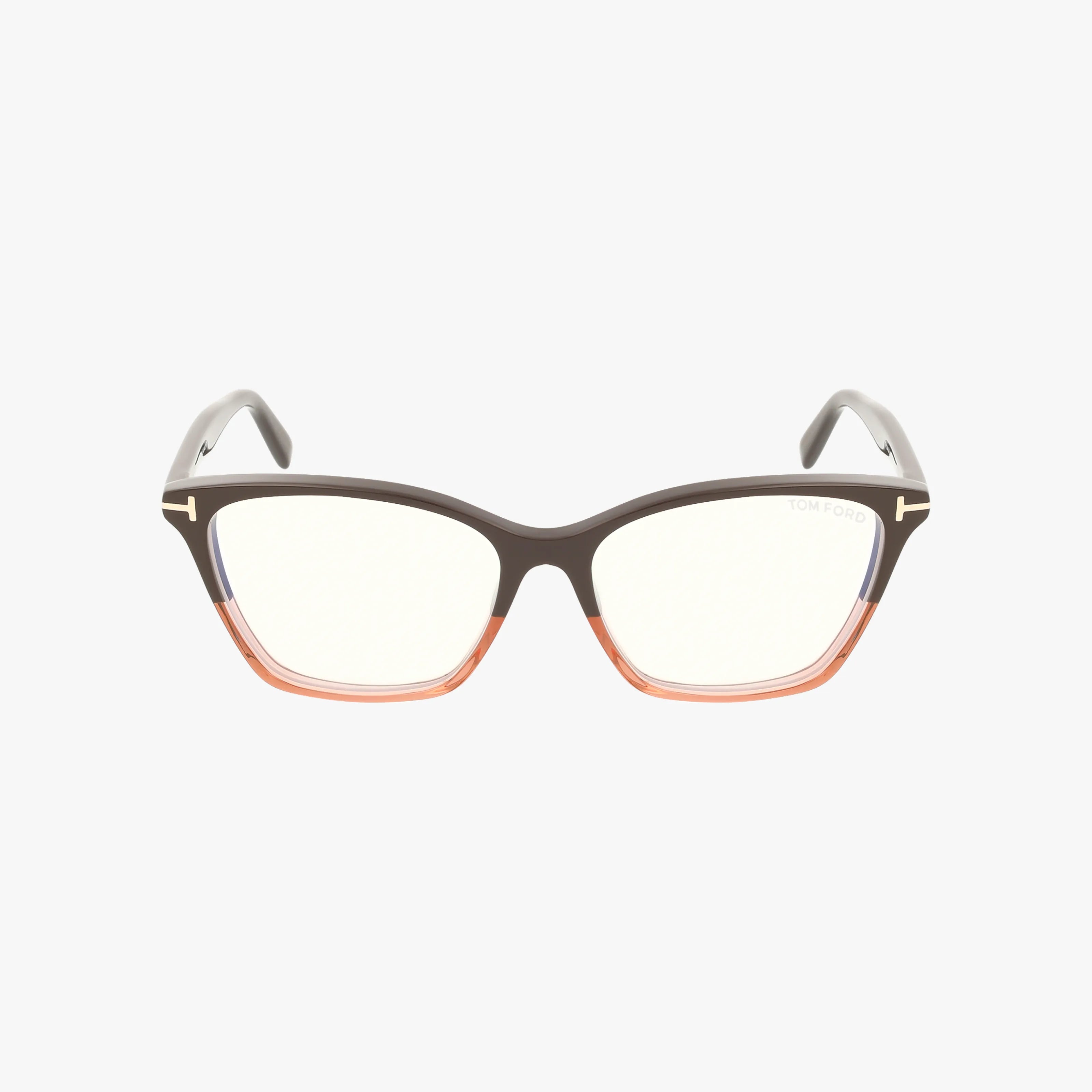 The Tom Ford FT5949-B features a rectangular designer frame with a brown upper rim, transparent orange lower rims, clear lenses, light gray temples, and a subtle logo on the left lens—classic Tom Ford style.