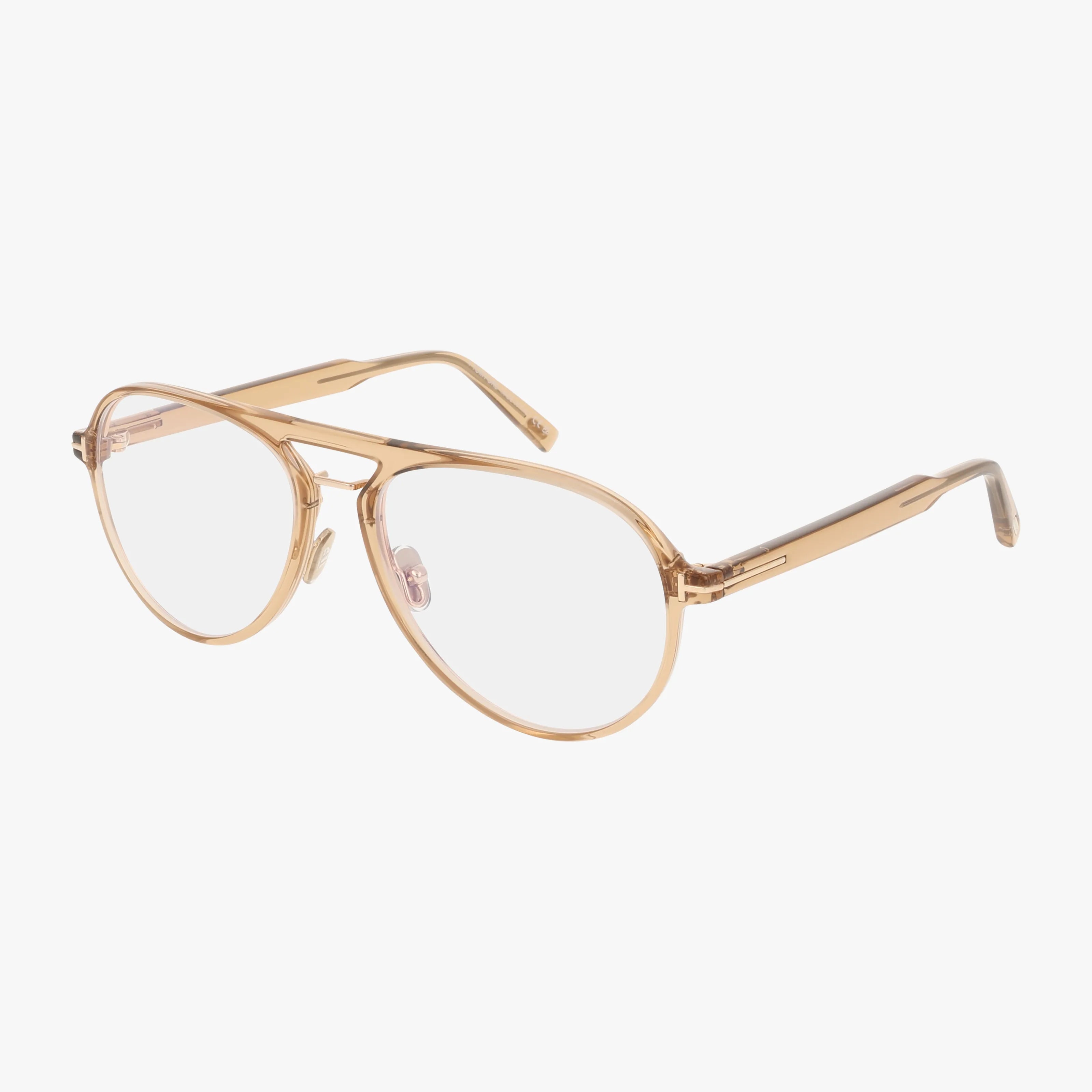 The Tom Ford FT5981-B eyeglasses in Green Light feature a clear aviator-style design with a light gold metal frame and transparent nose pads, combining distinct style and functionality, displayed on a white background.